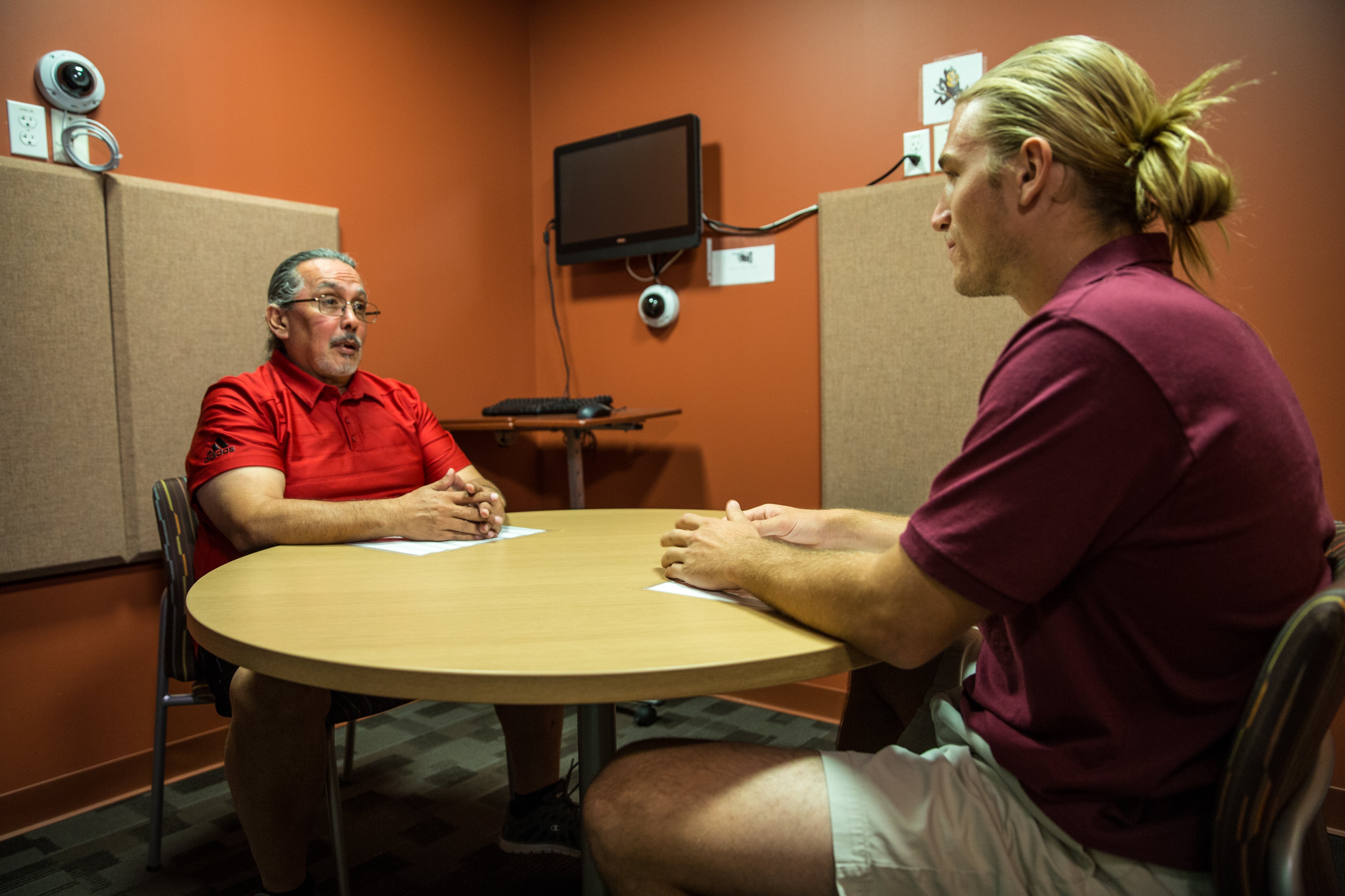 two people talking at table