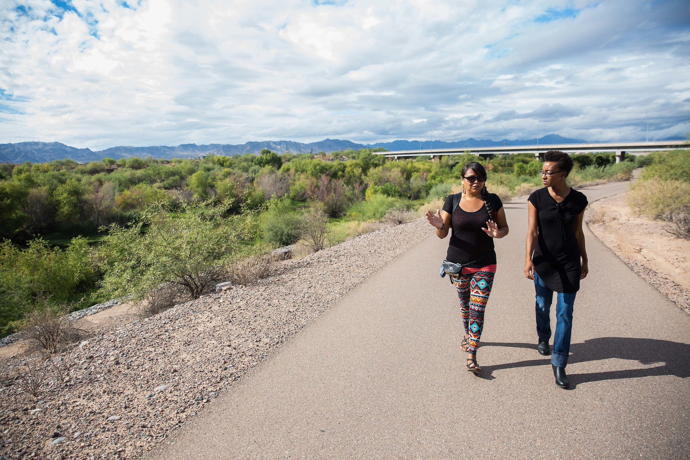 two people walking in preserve