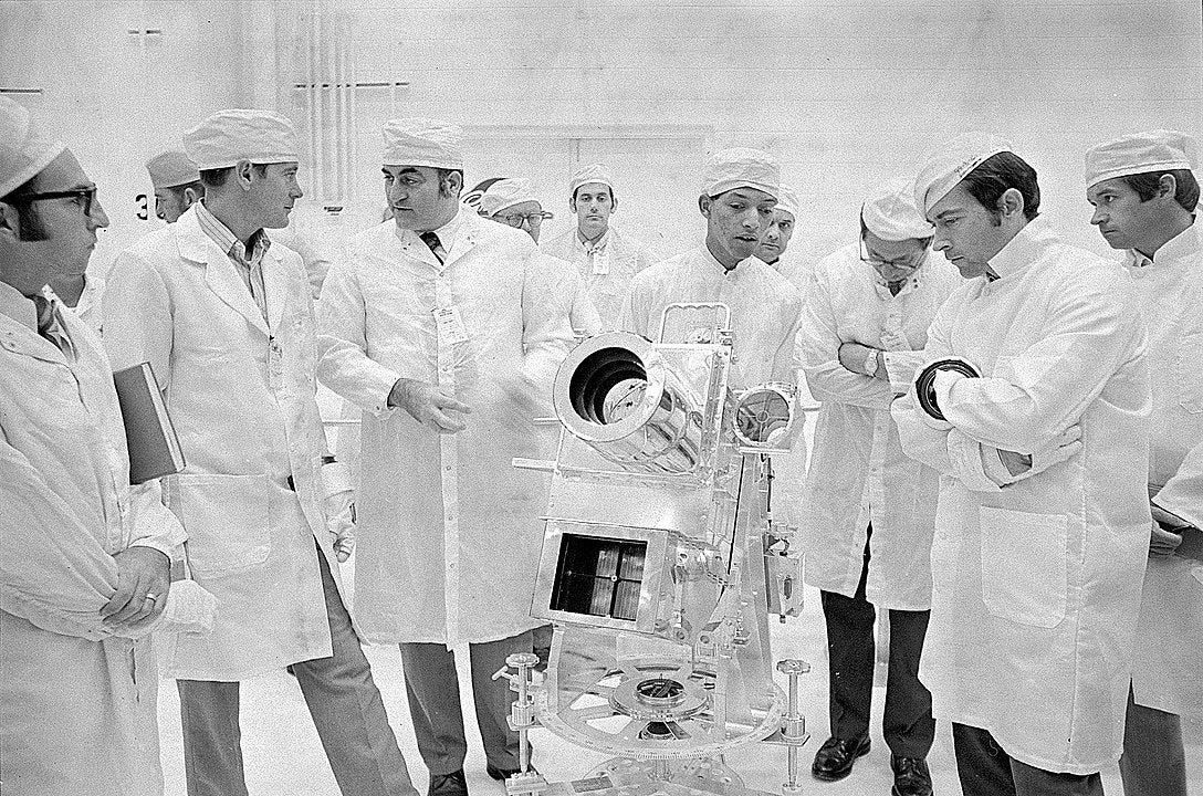 George Carruthers, center, principal investigator for the Lunar Surface Ultraviolet Camera