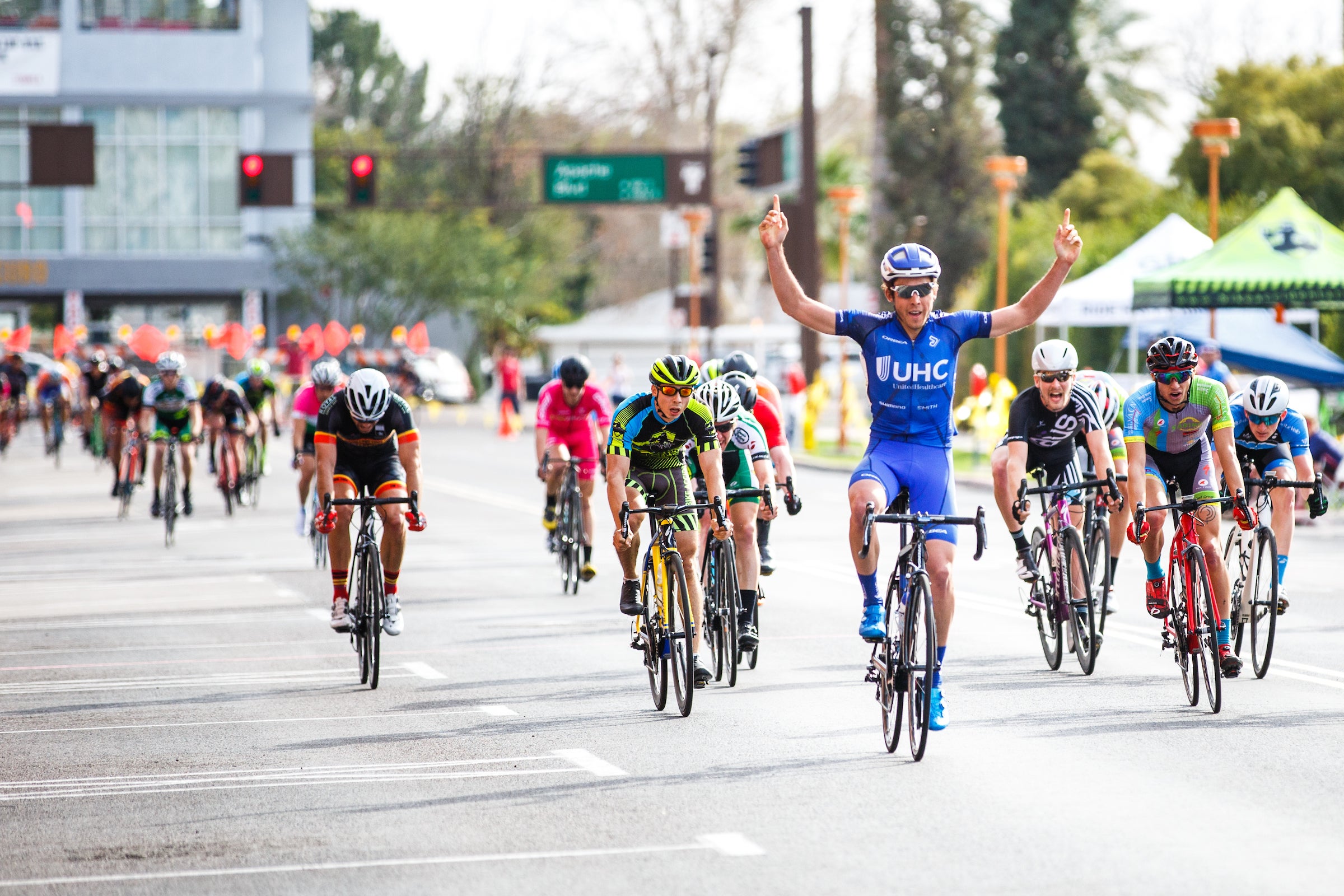 man celebrating winning bike race