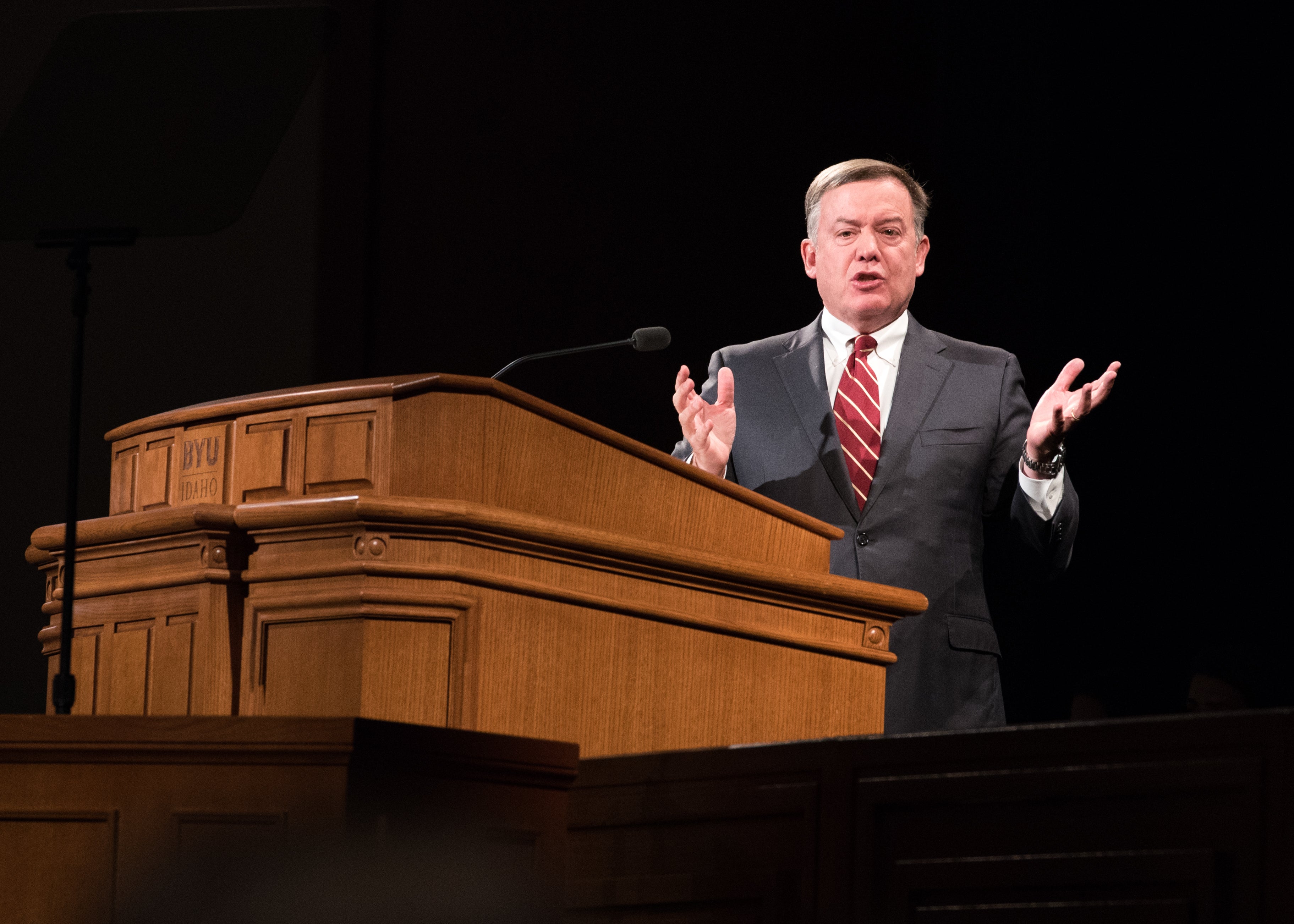 man speaking at pulpit