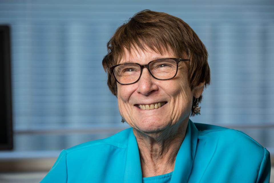 Woman in glasses smiling