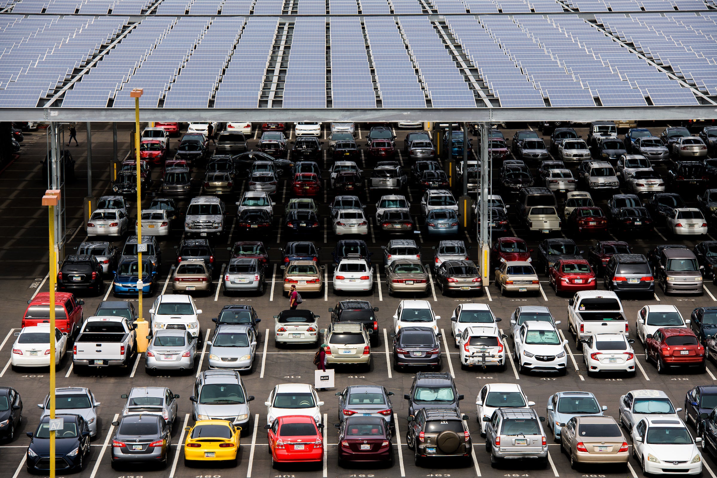 Parking lot with solar panel shade structure