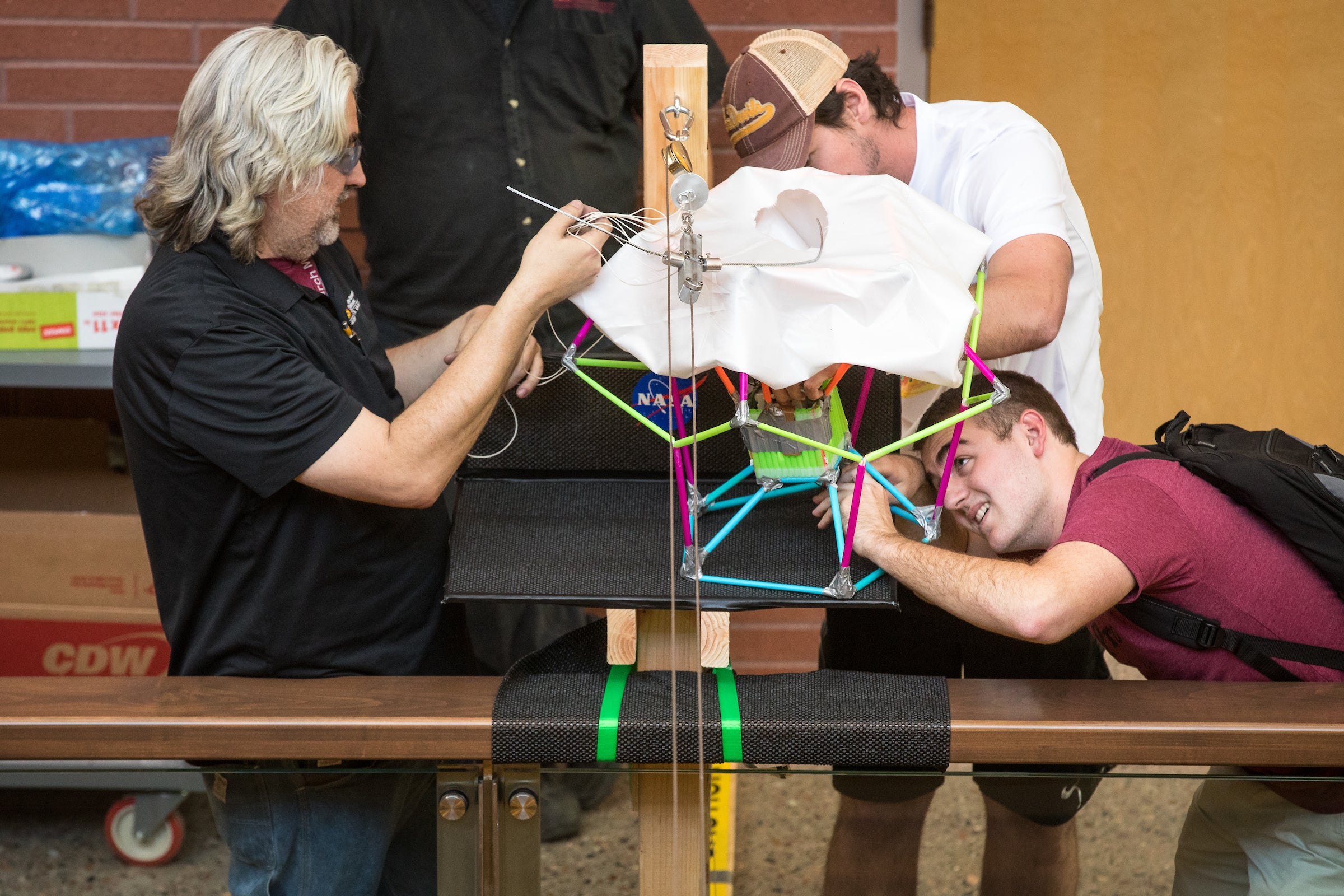 ASU Jerry Lacey, staff member, Nathanael Mains, junior in Astrophysics and Michael Garland, sophomore in Aerospace Astronautics