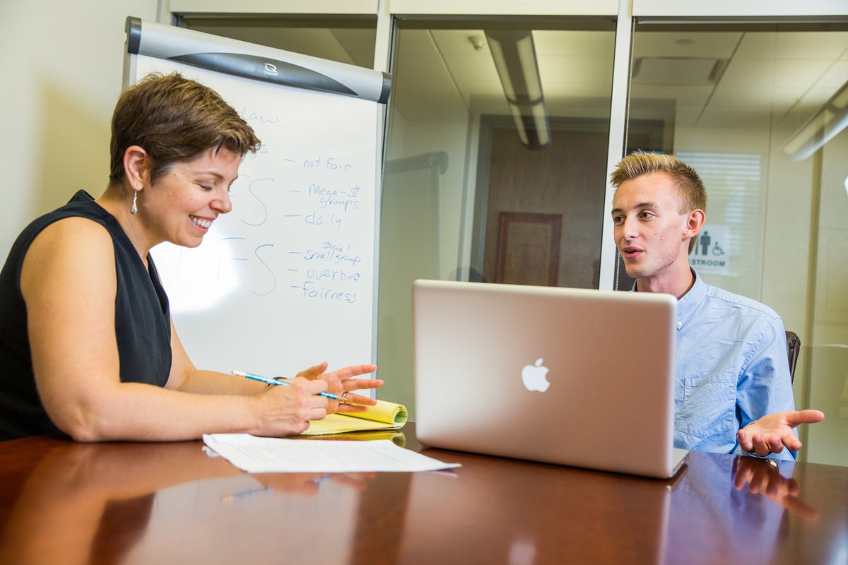 Woman and man with computer