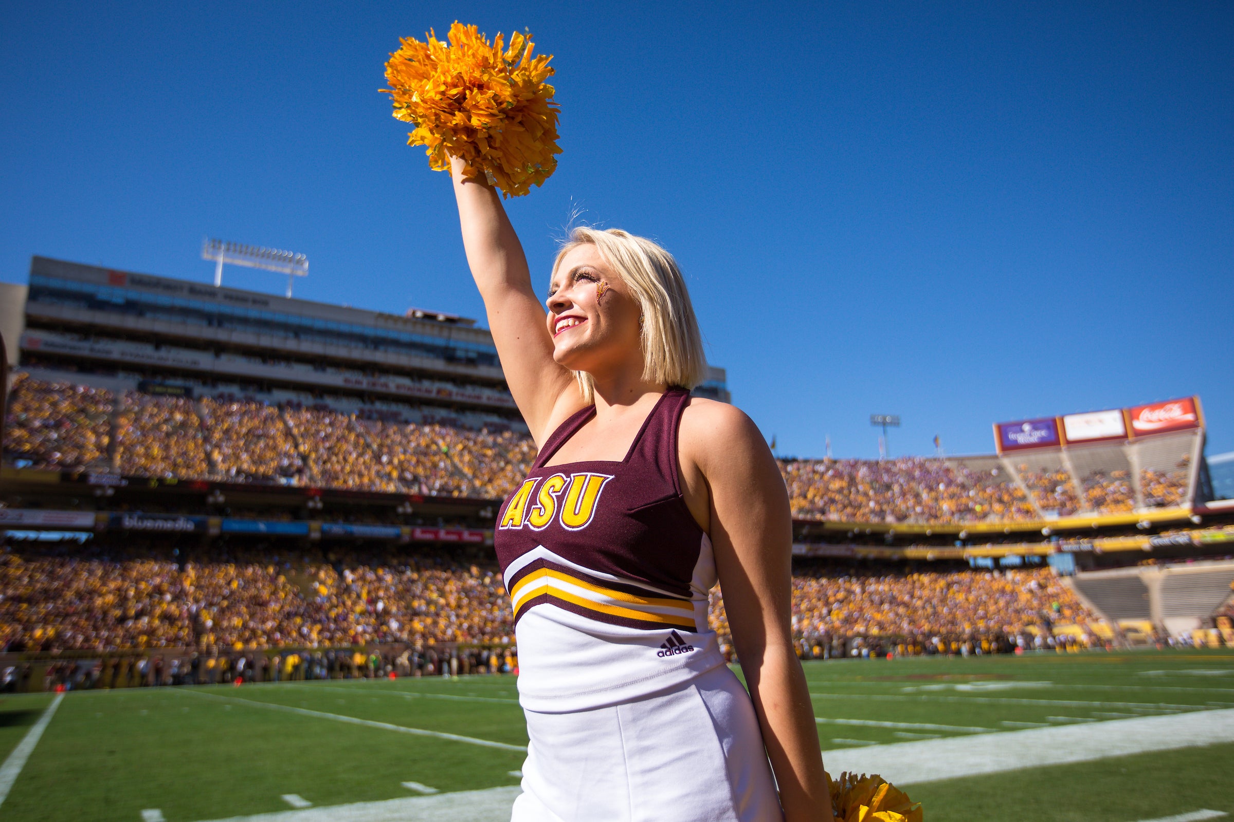 cheerleader at ASU Homecoming game