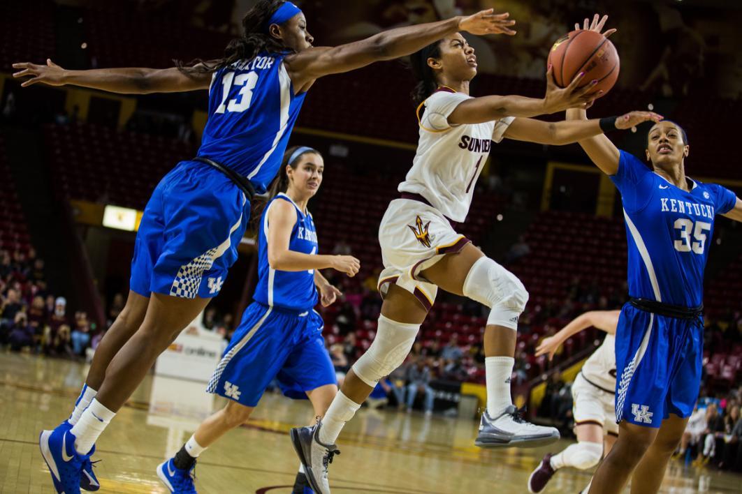 Women playing basketball.