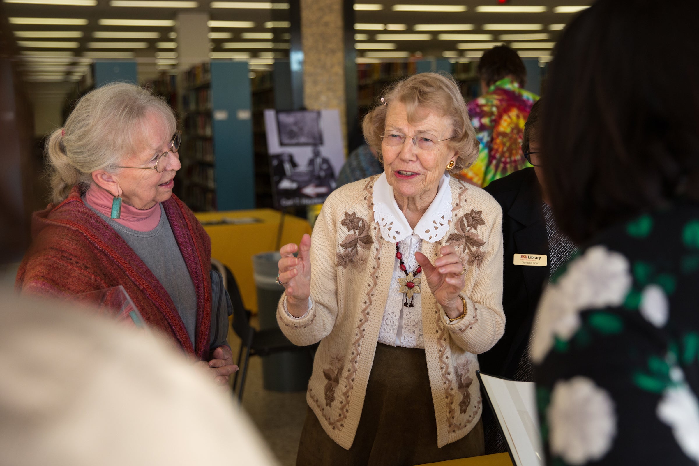 woman talking to guests