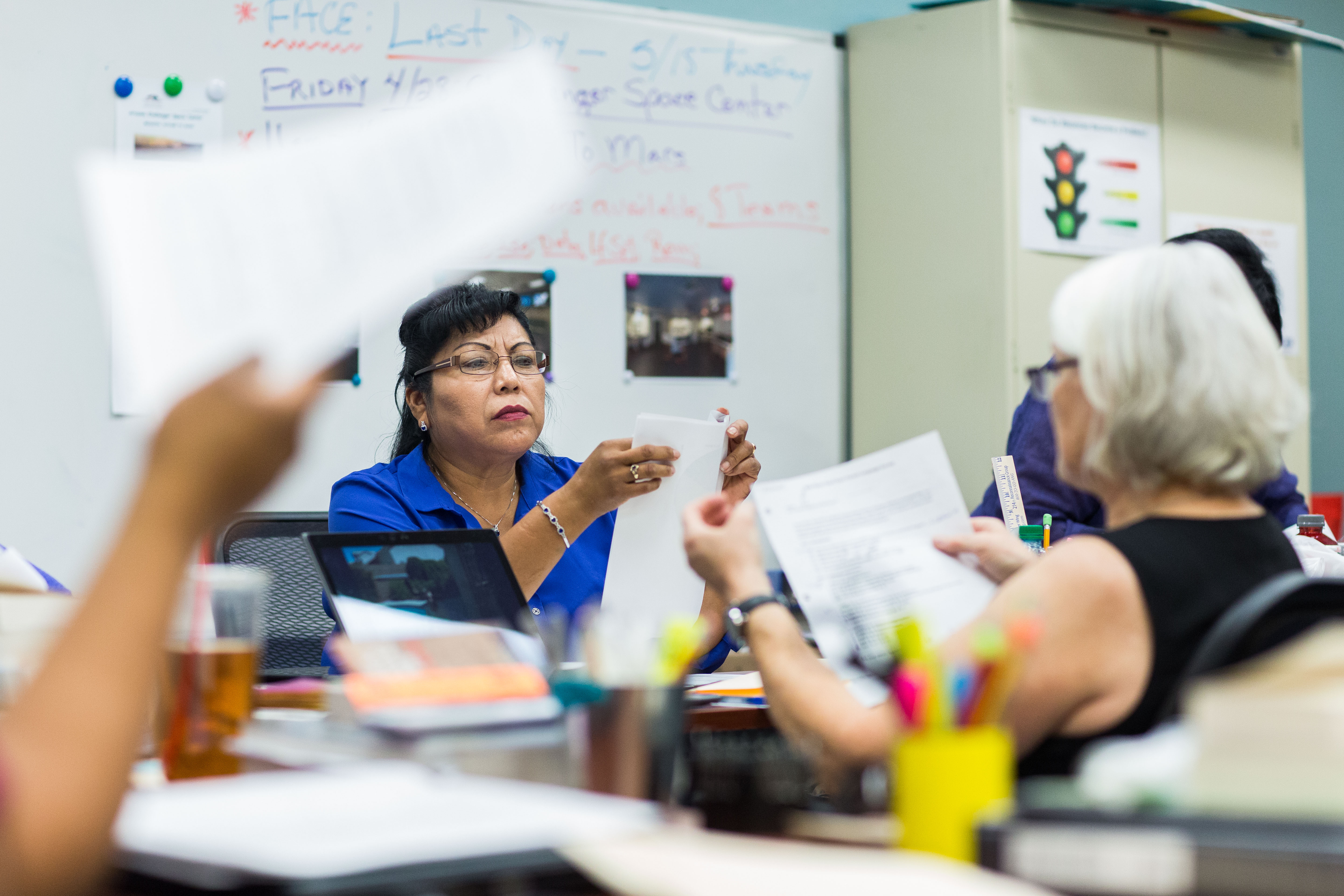 student discusses with teacher