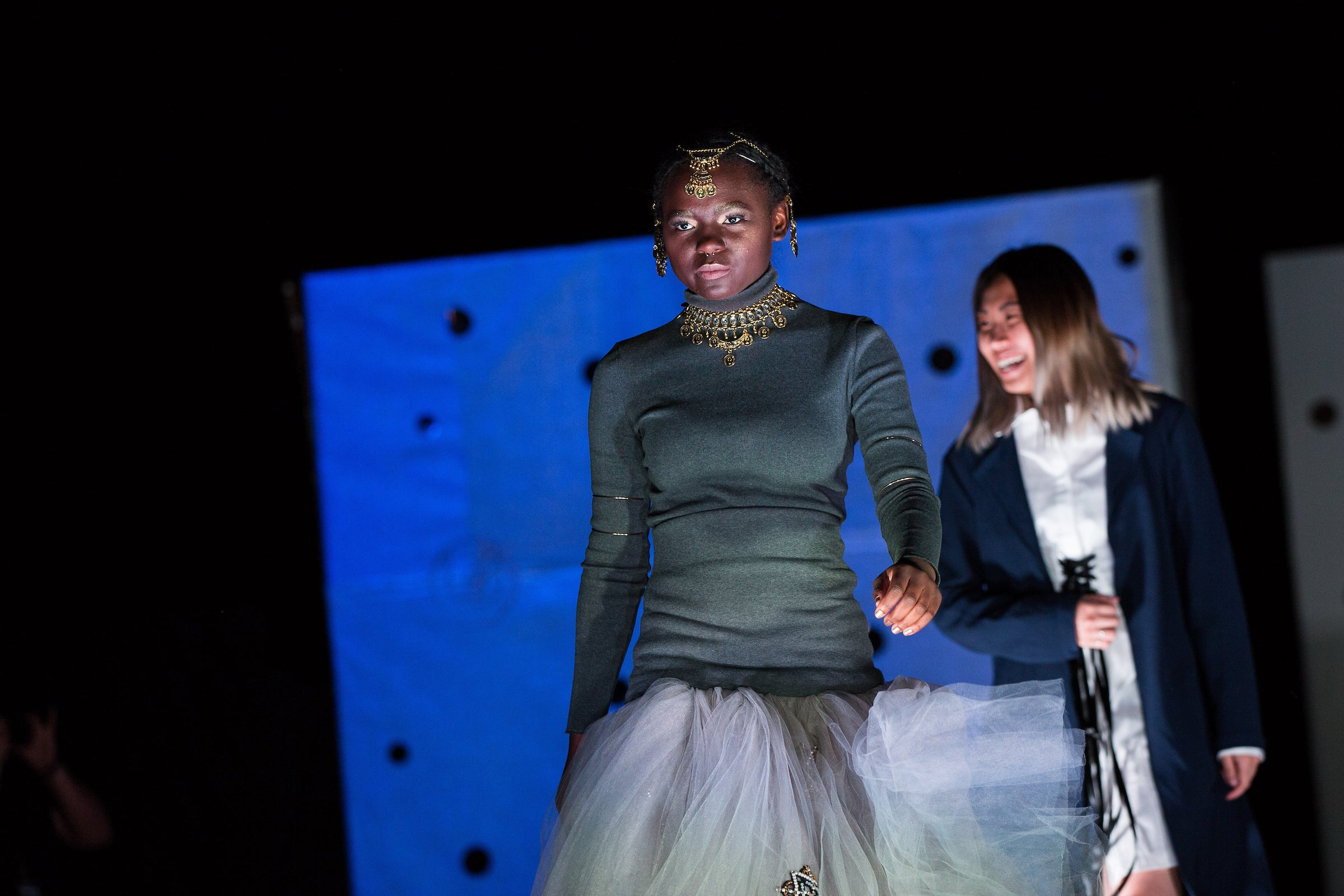 A model walks the runway at an ASU fashion student show