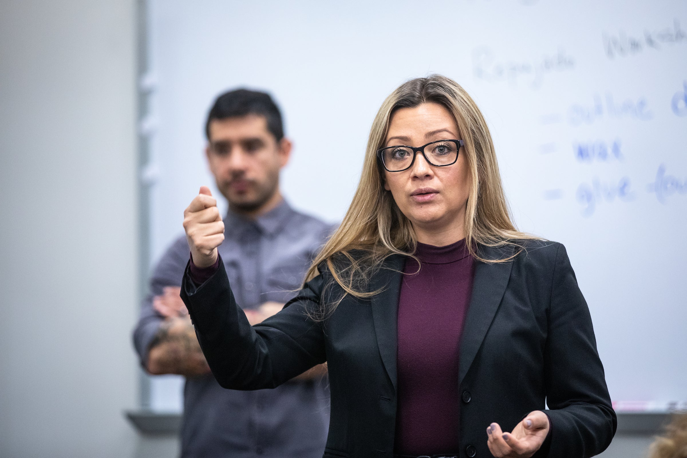 woman talking in front of classroom