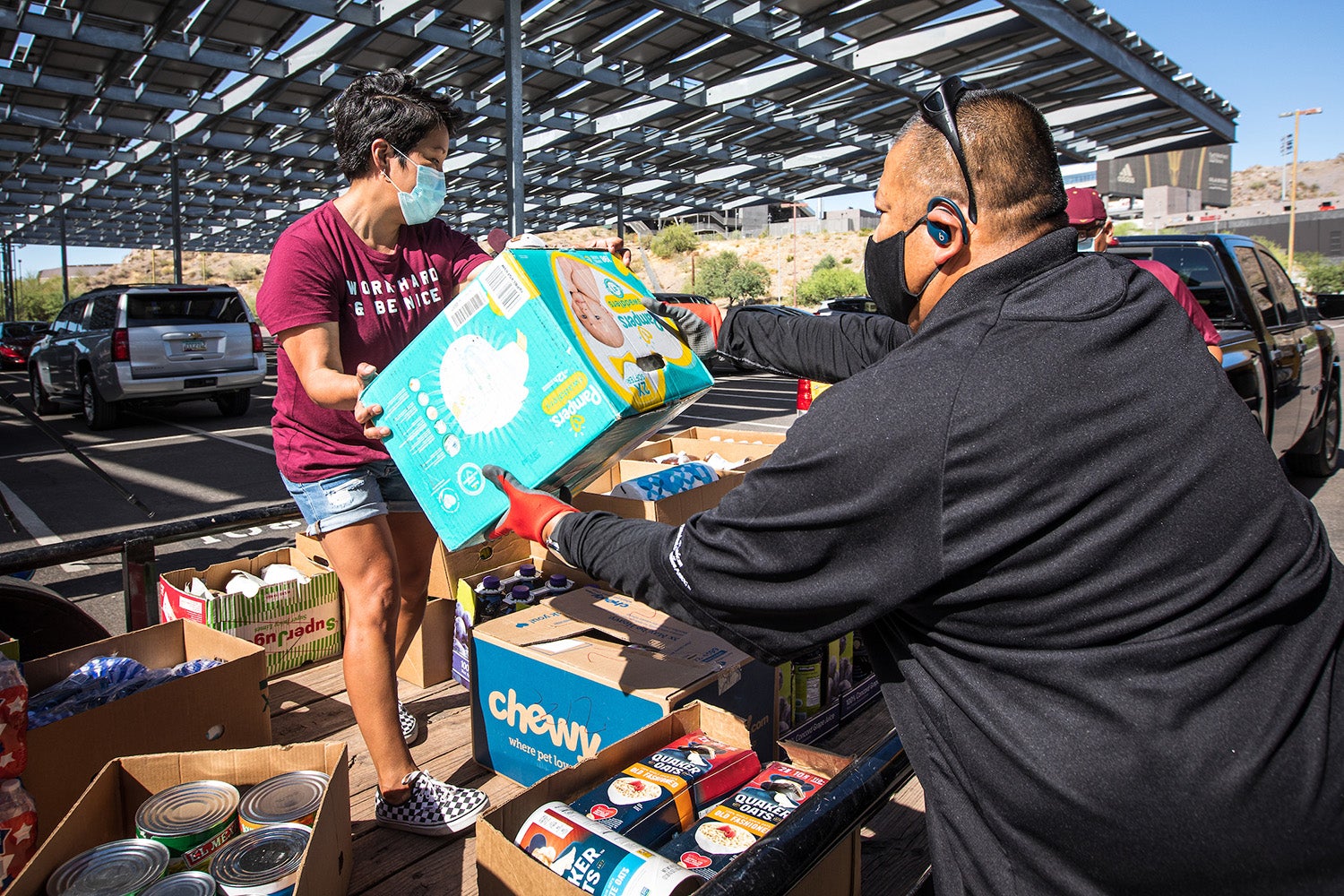 Volunteers unloading supplies donations 