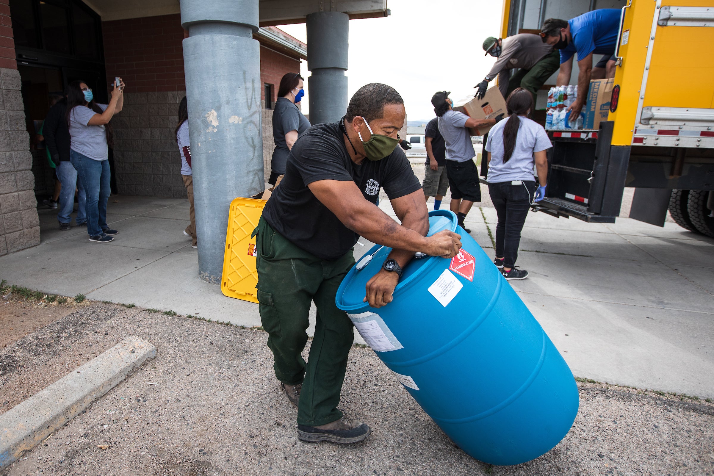 Volunteers unloading supplies donations 