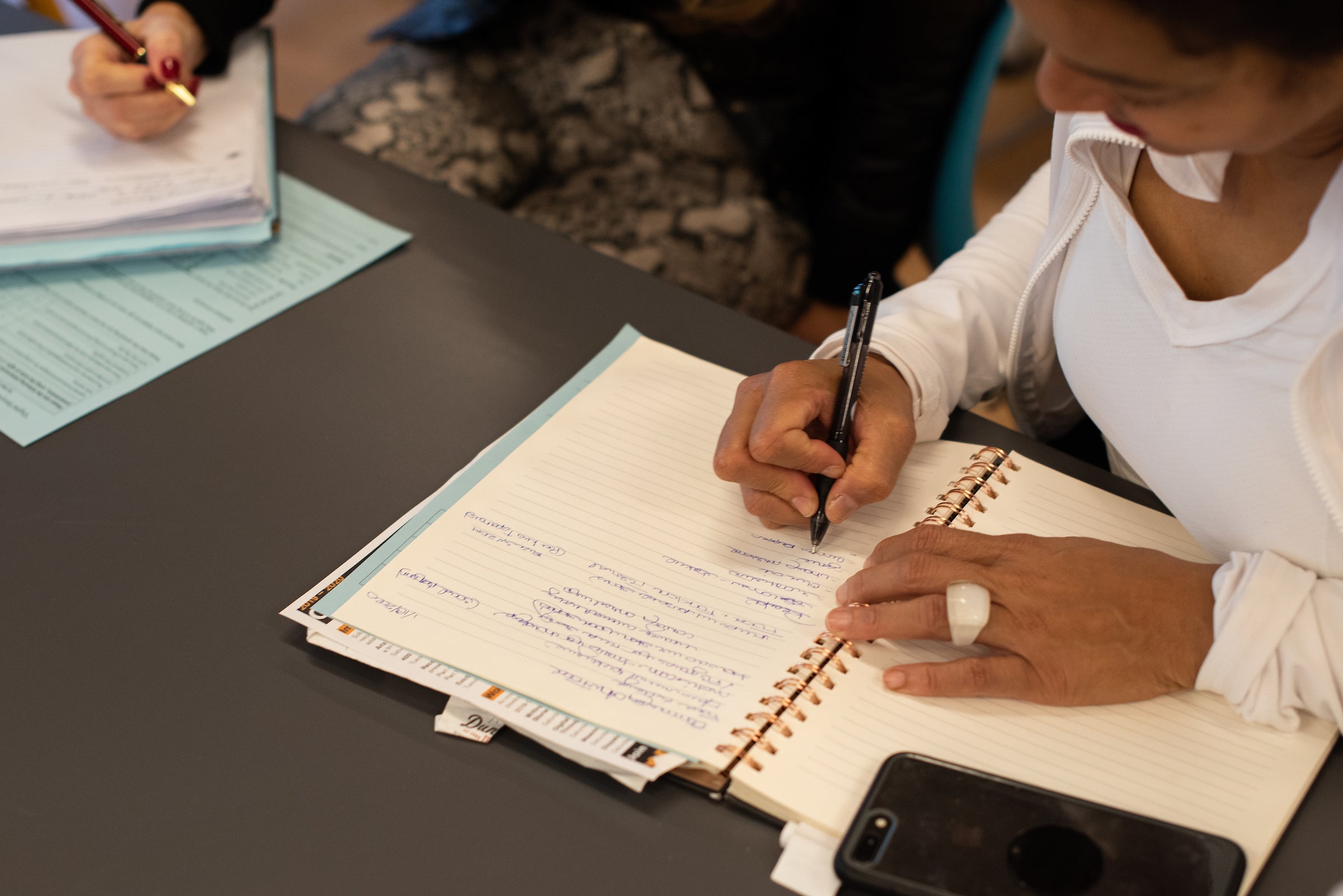 woman writing in a notebook