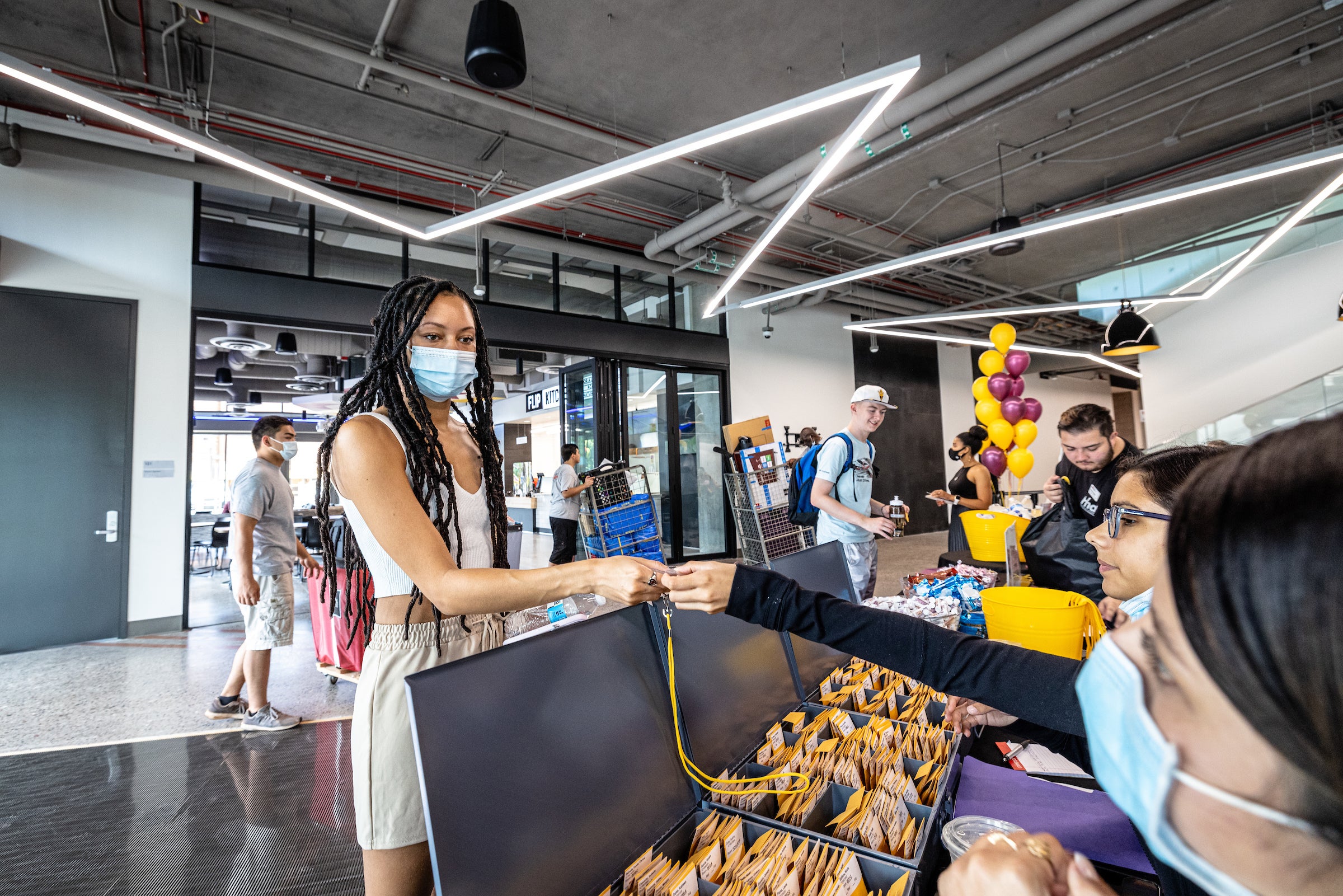 student getting residence hall keys