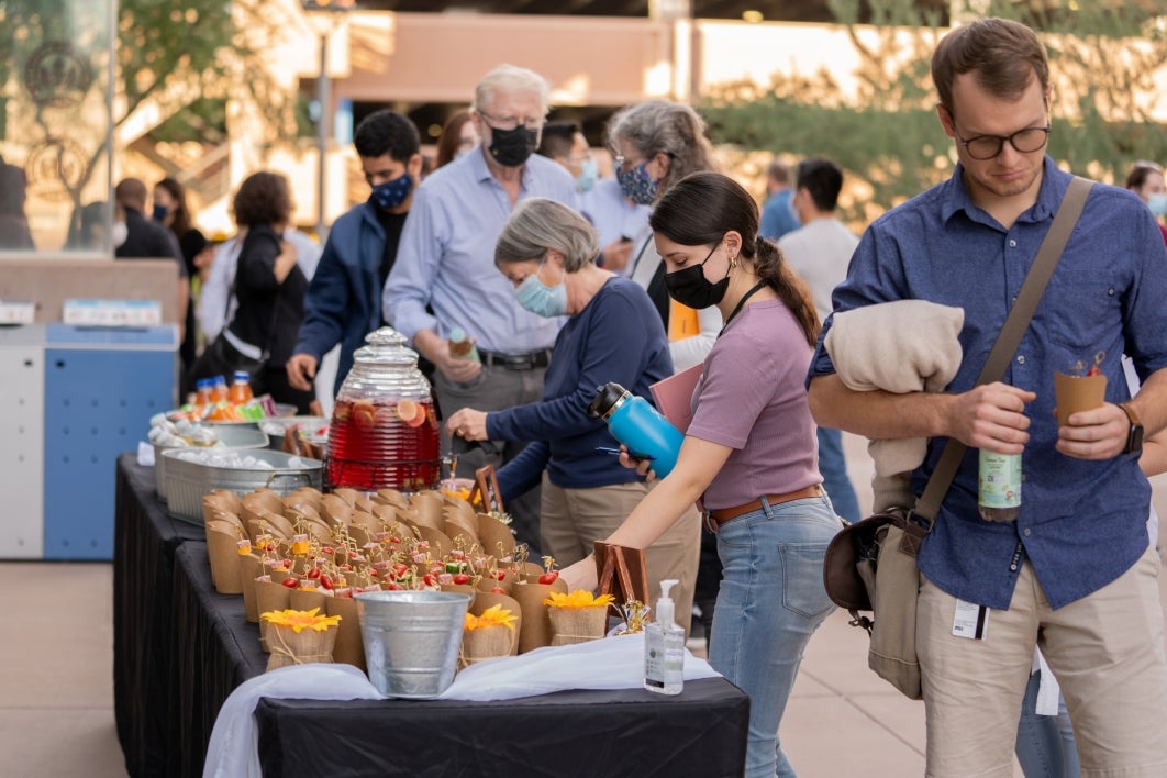 People mingle about at a reception at the O'Keeffe Lecture