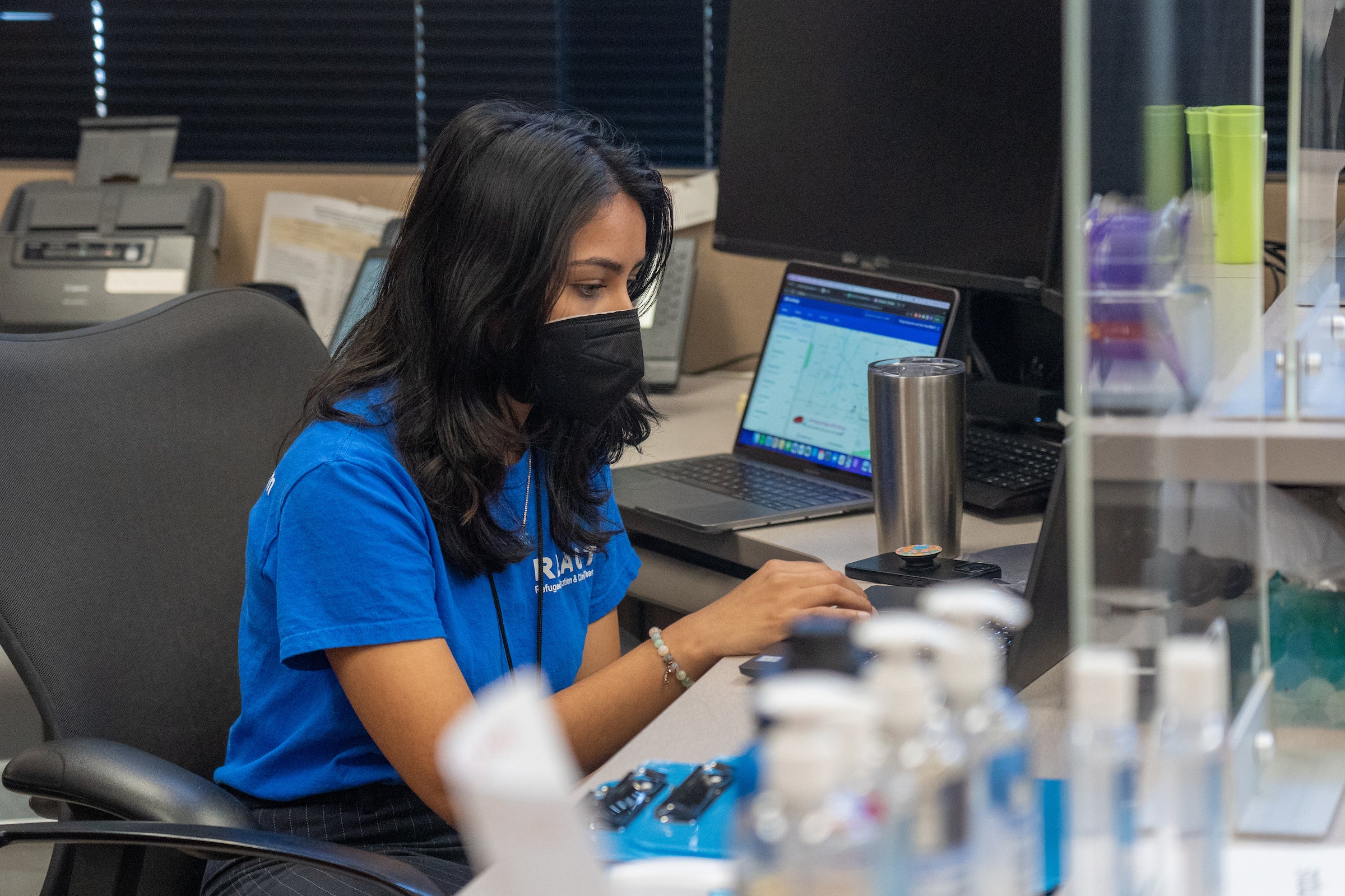 Student worker sitting at front desk at health clinic