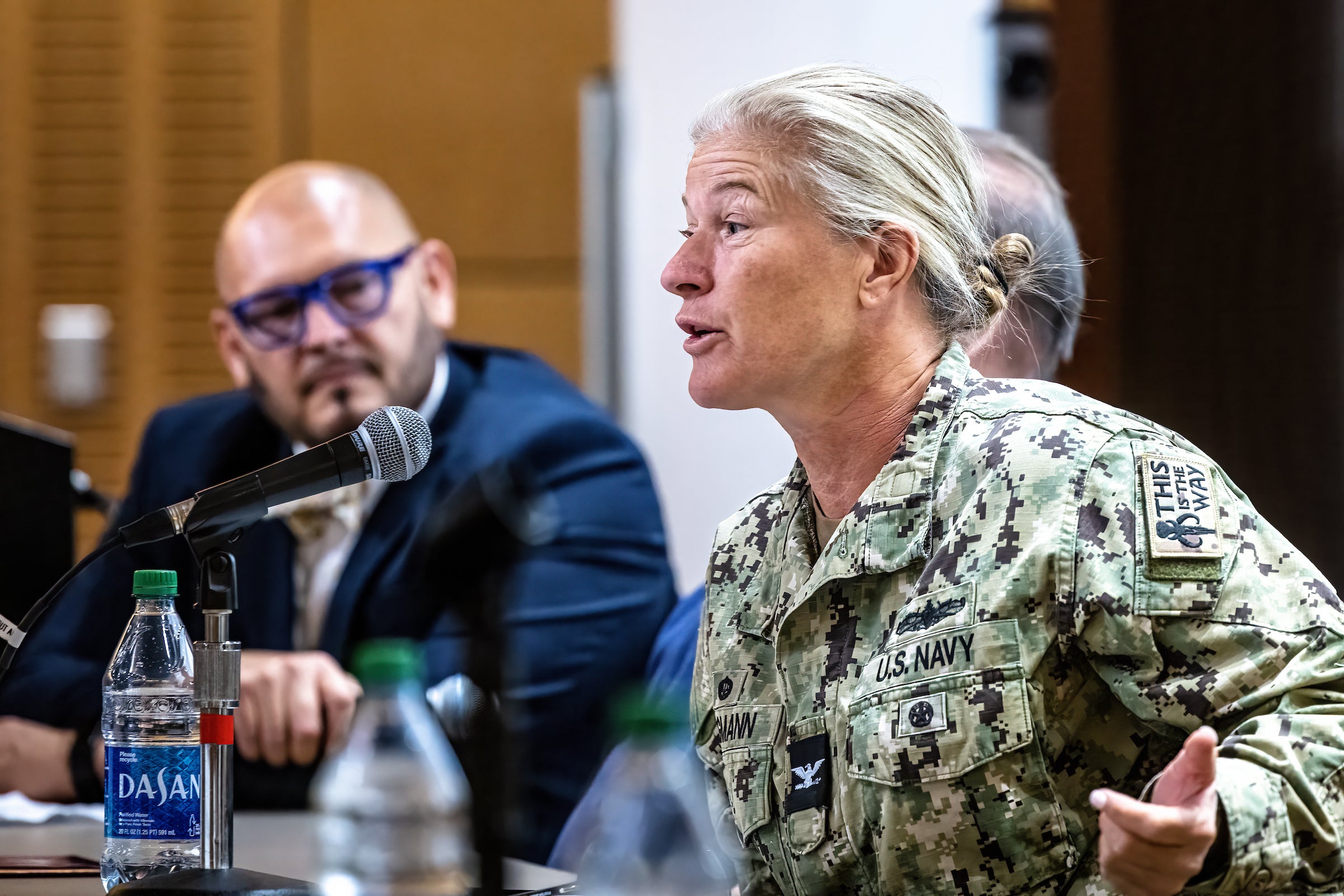 woman speaking into microphone