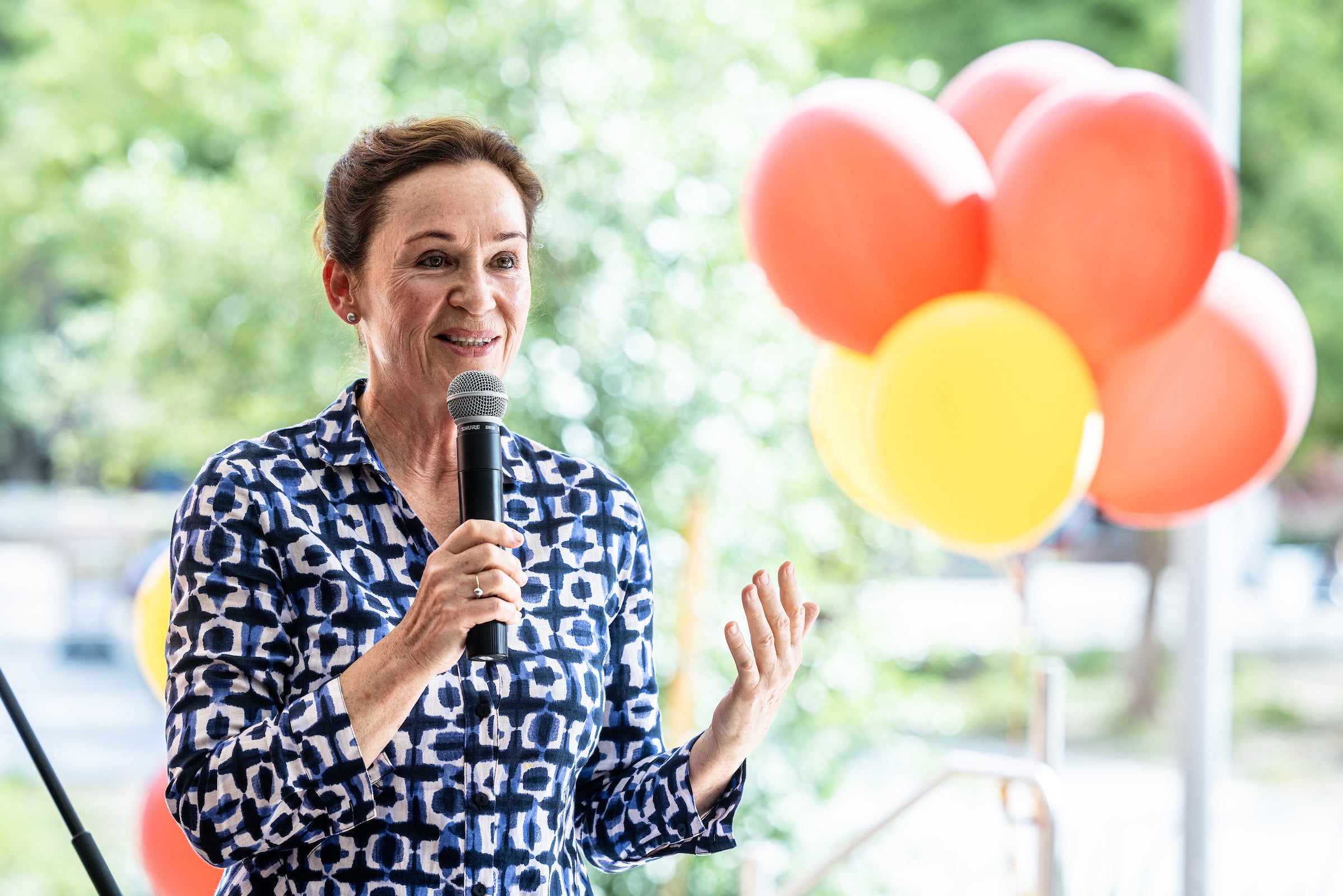 woman speaking at outdoor event