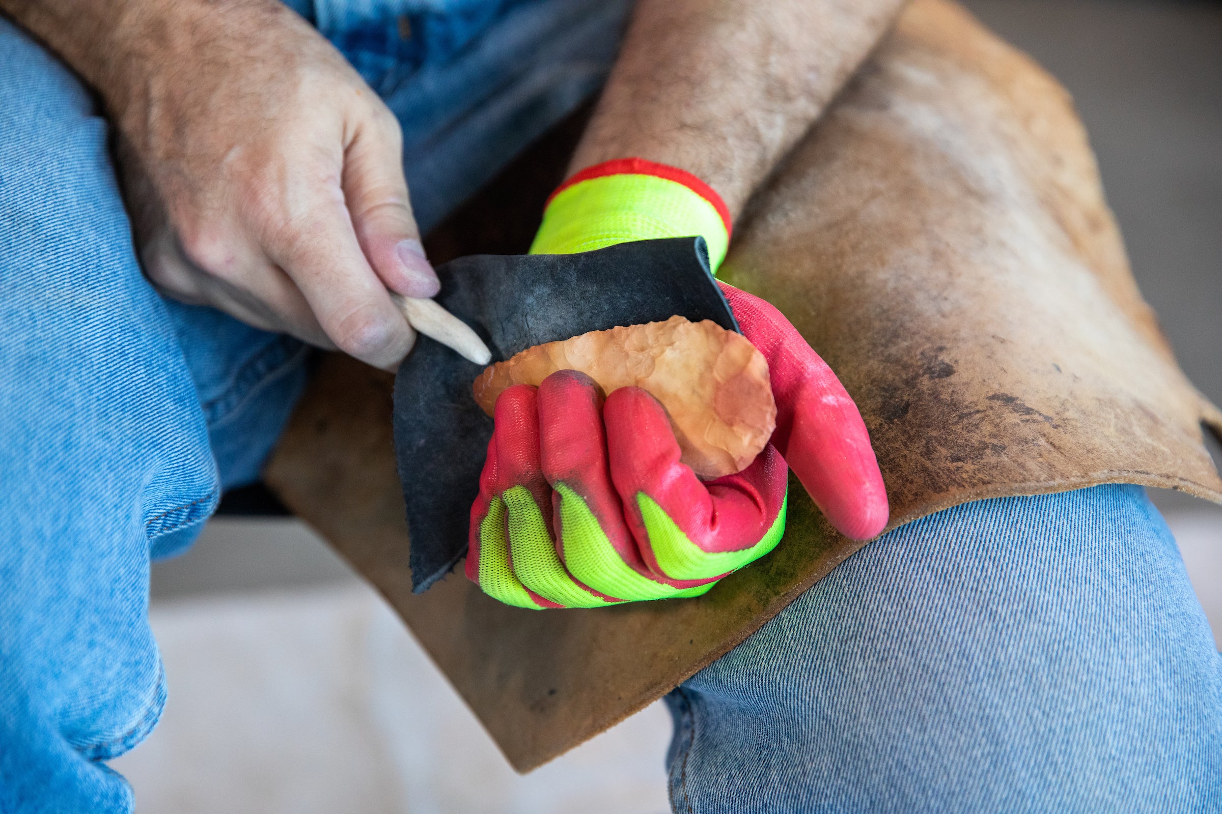 Close up of stone being carved into a tool