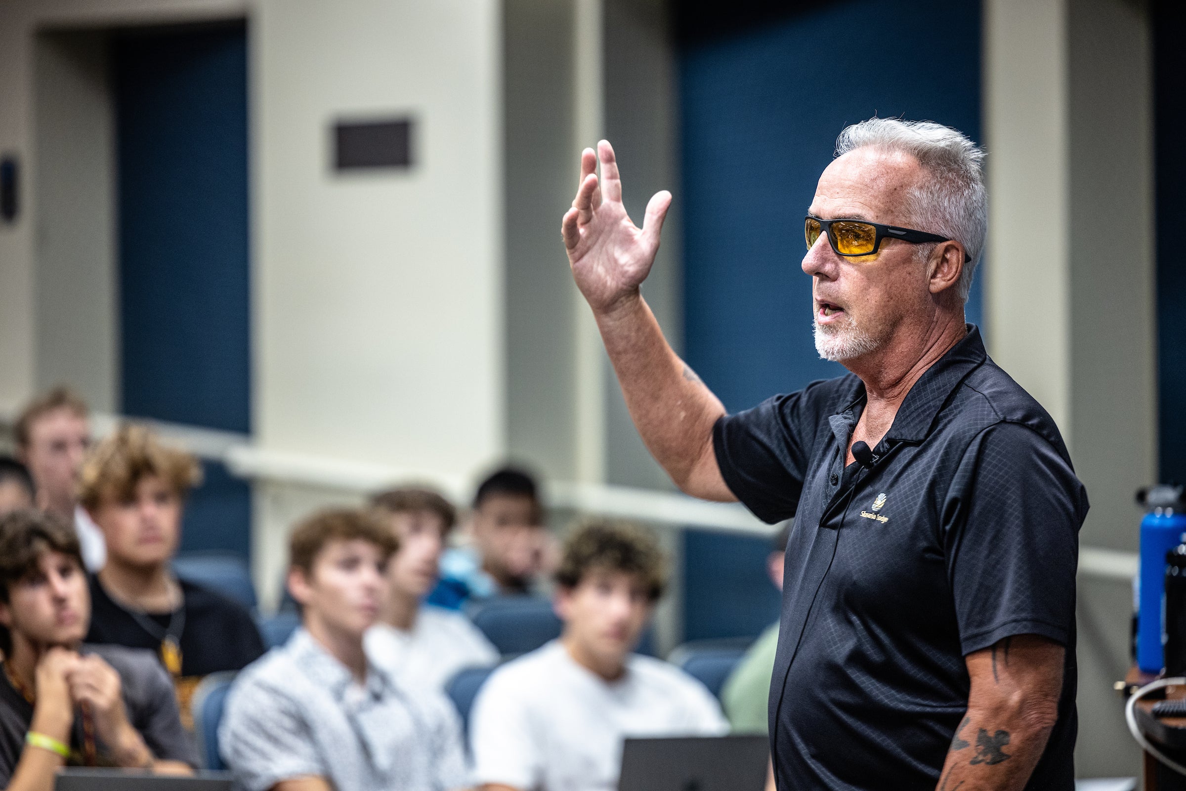 Man teaching class to students