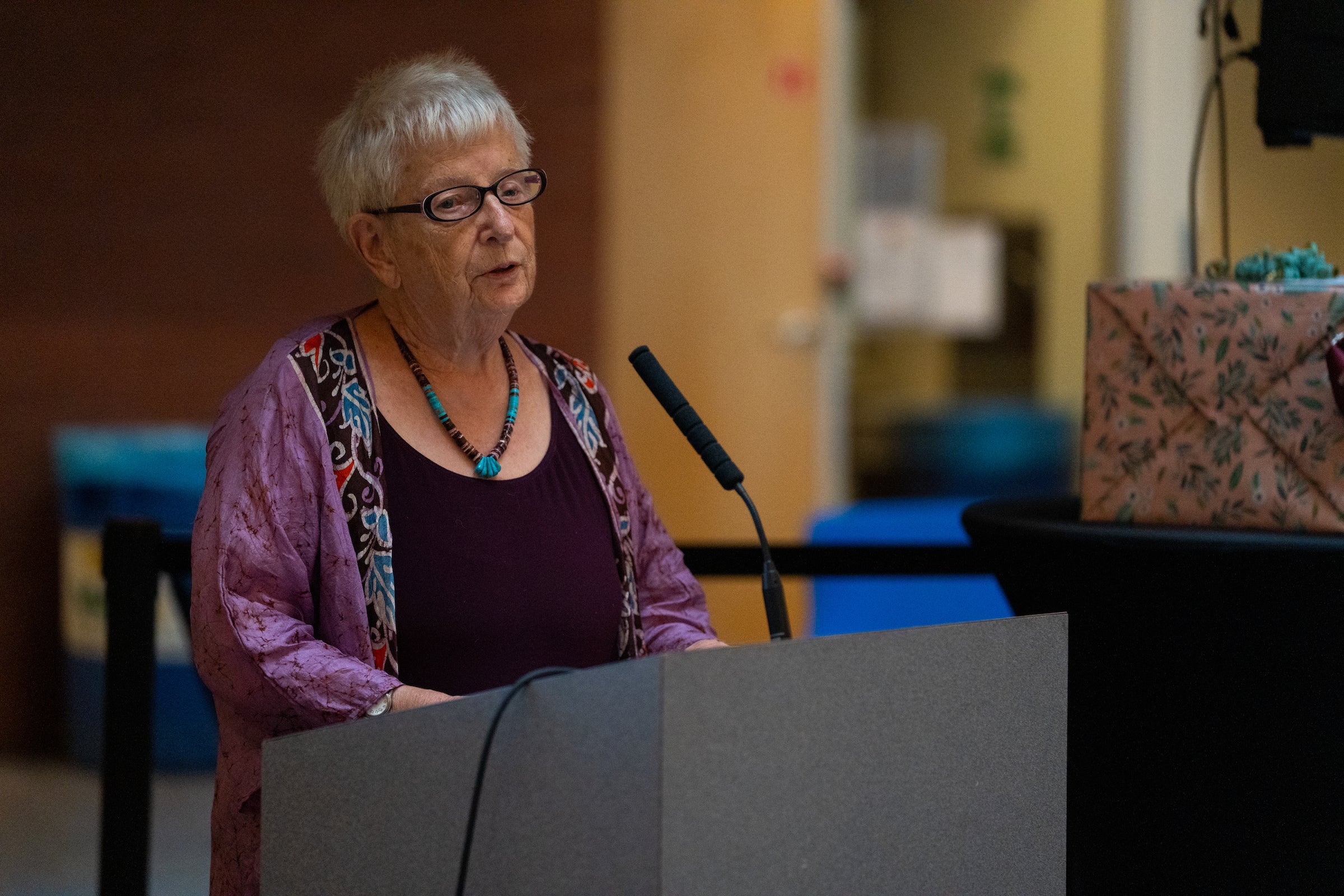 Woman speaking at lectern