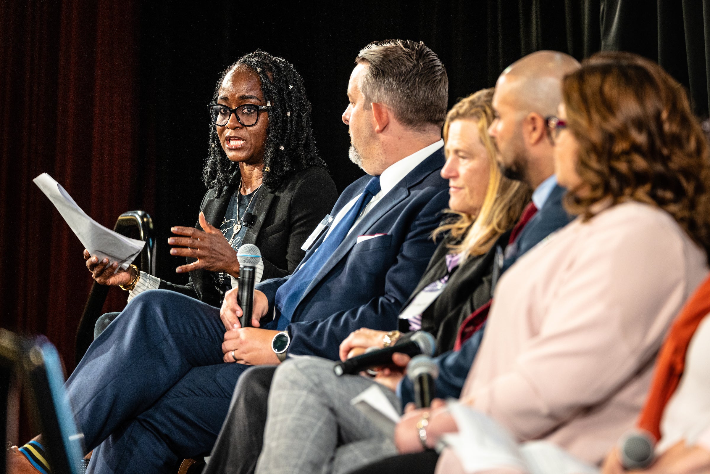 Group of people on panel on stage