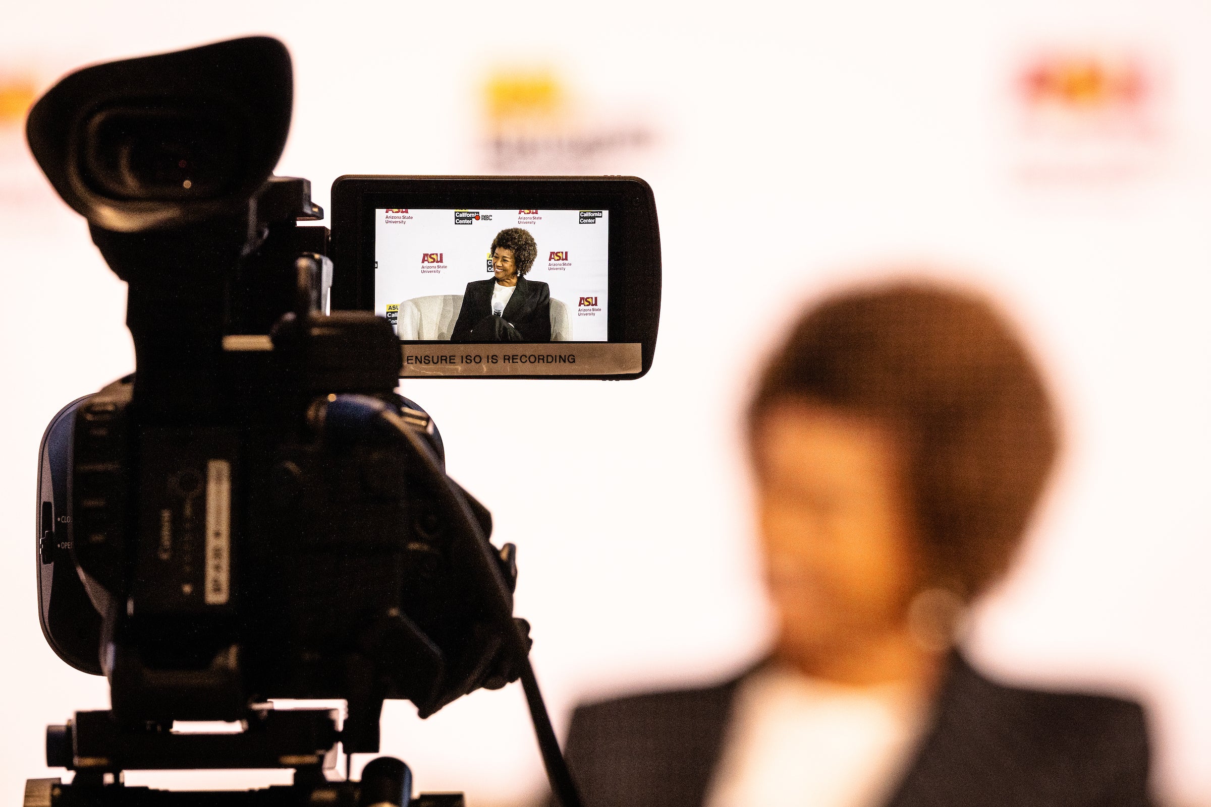 View of woman on stage through camera