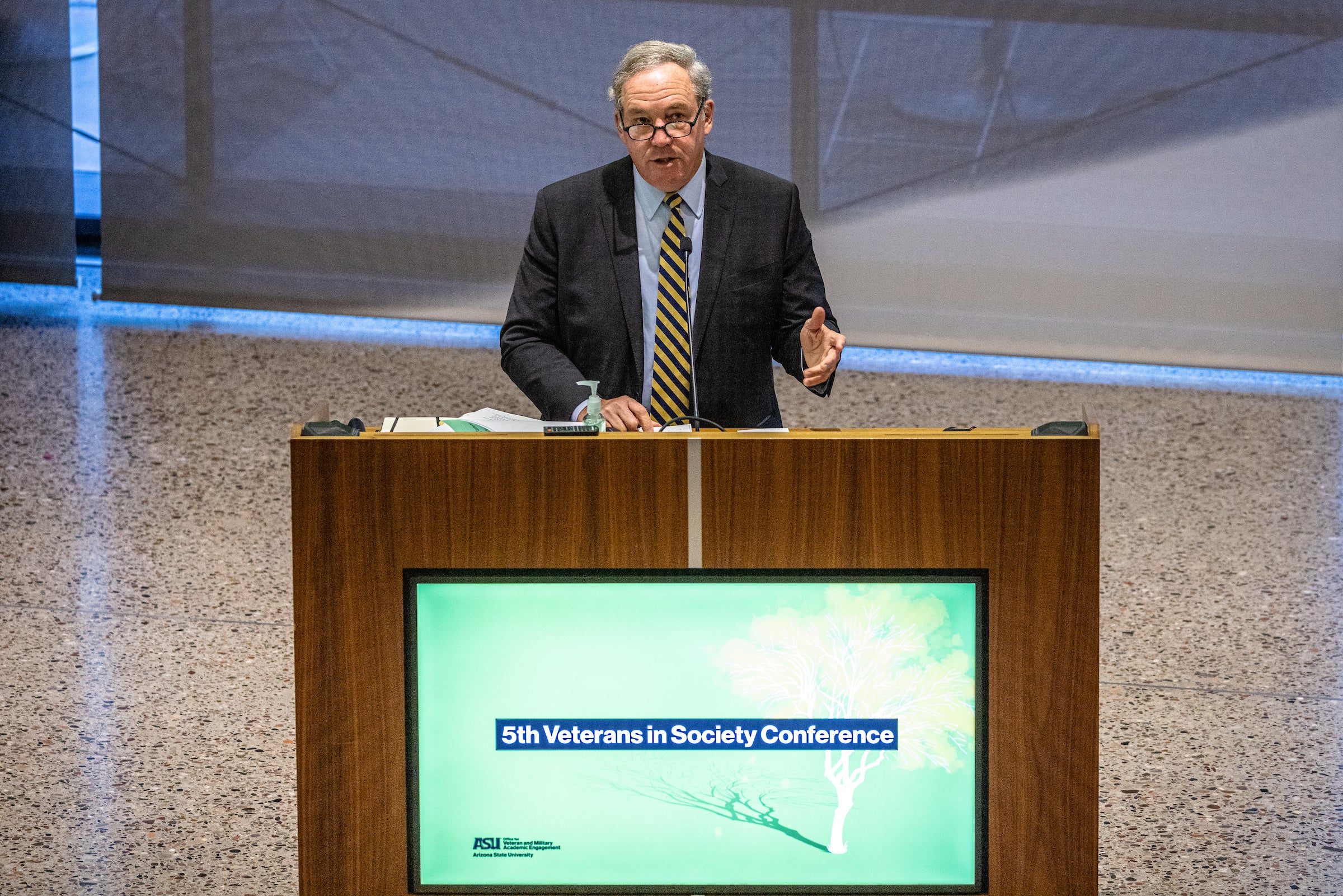 Man speaking at lectern