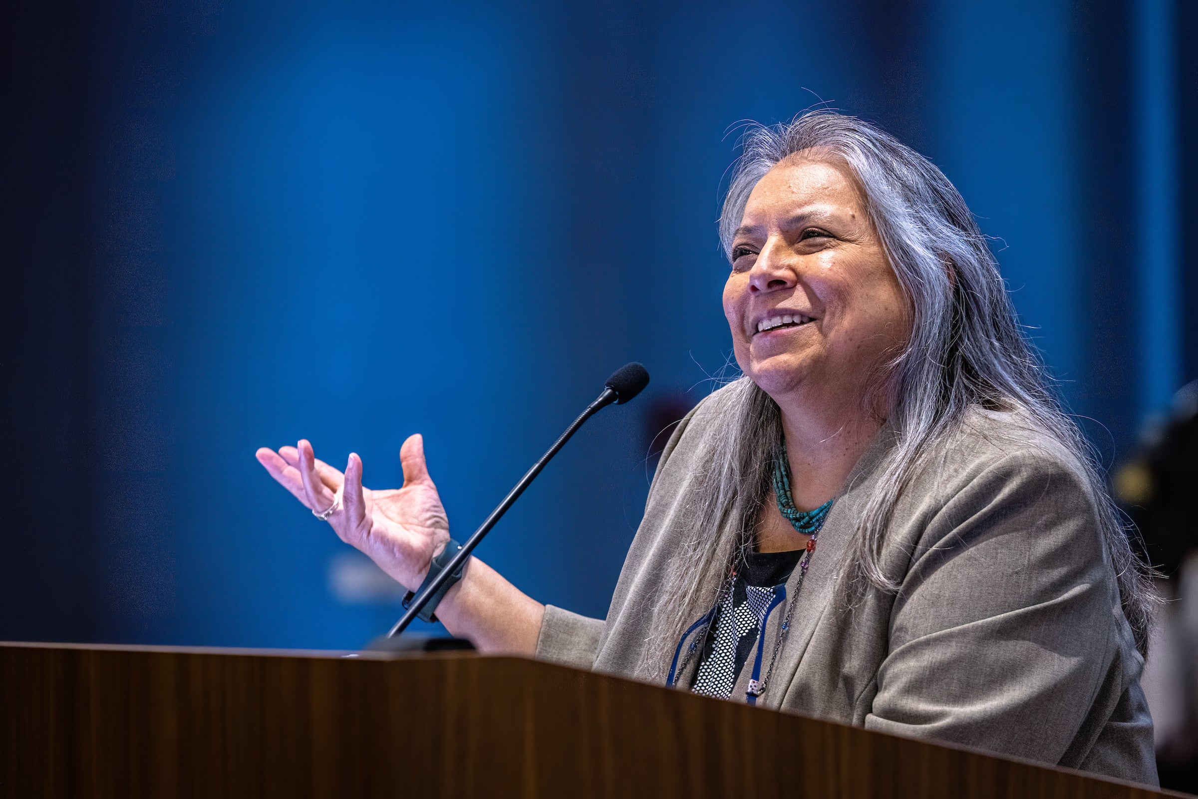 Woman speaking at lectern