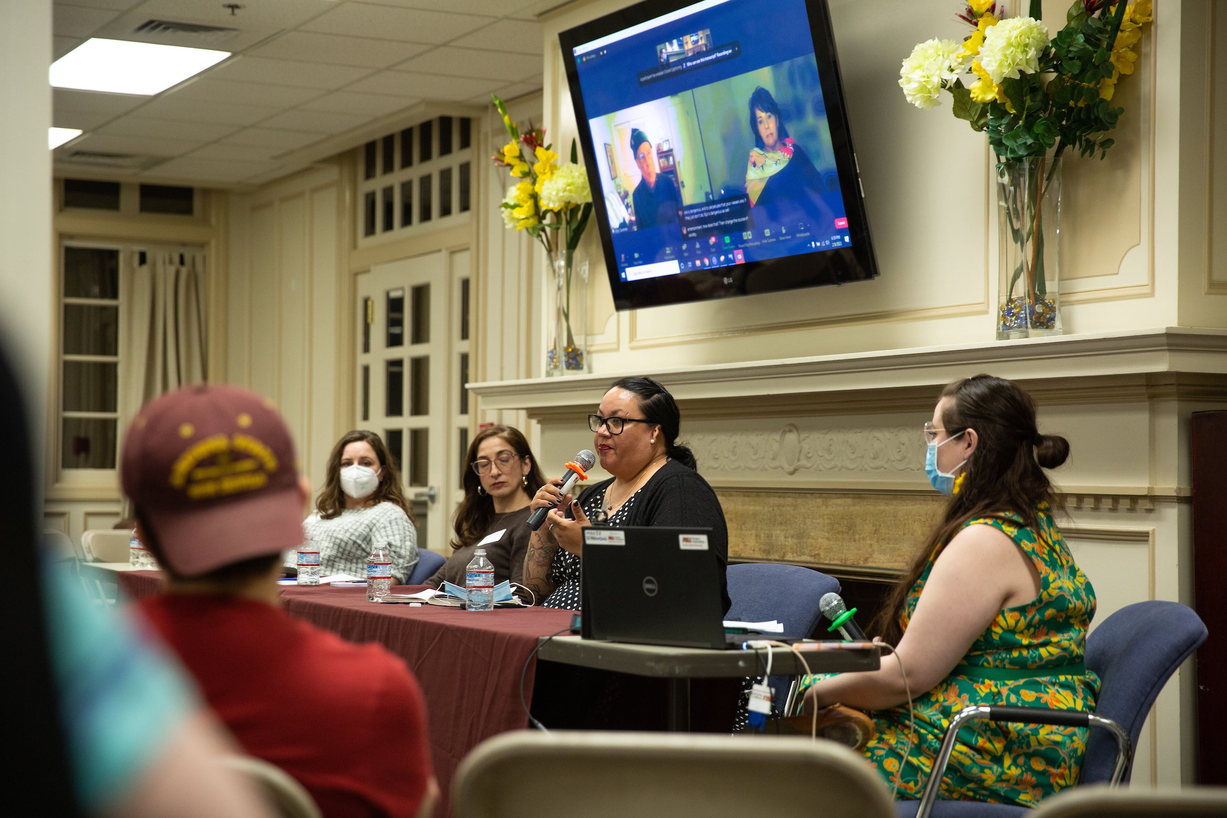 Panel of women behind table at event