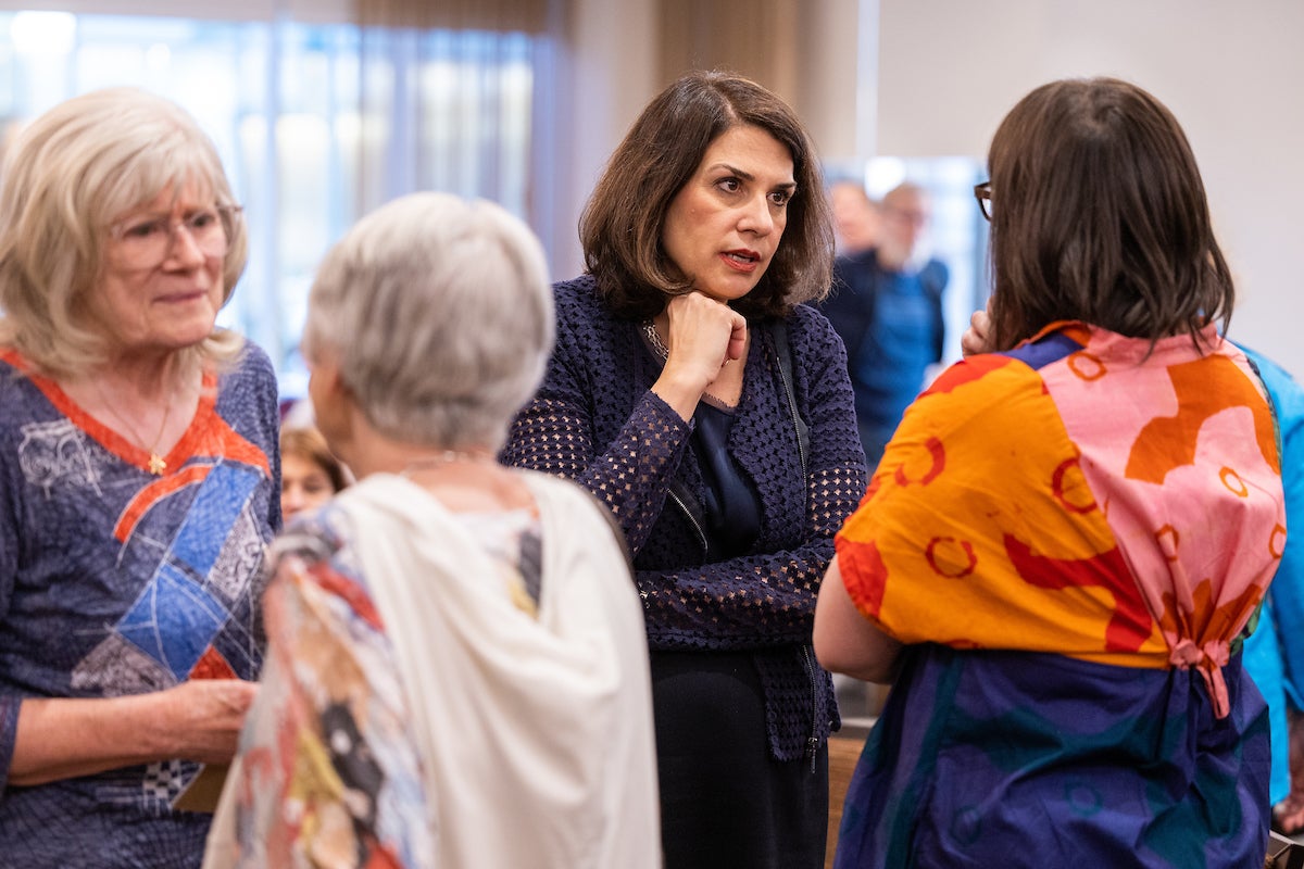 Woman talking lecture attendees