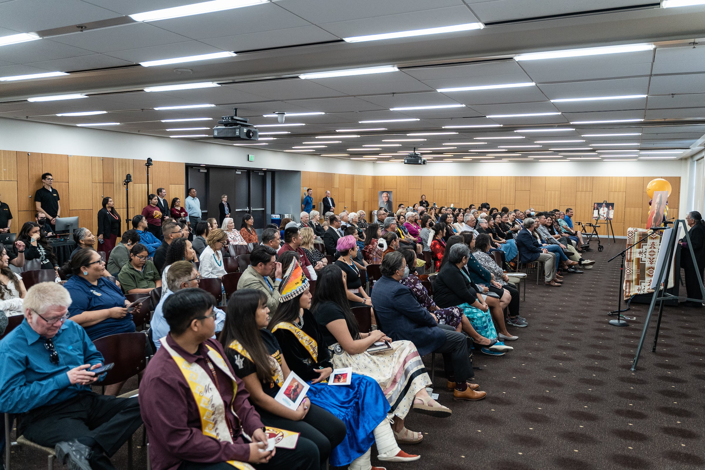 Crowd seated for a memorial