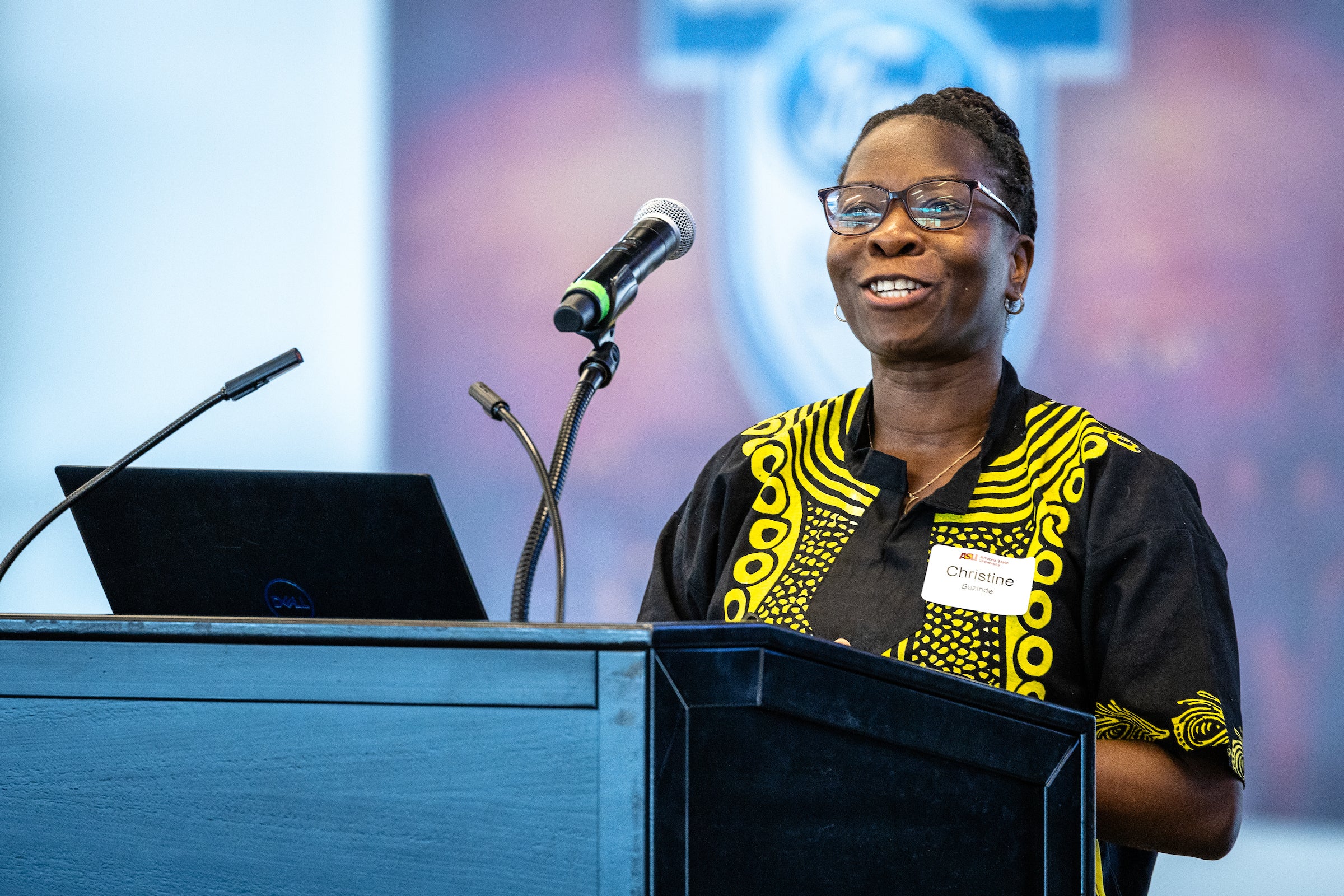 Woman speaking behind lectern