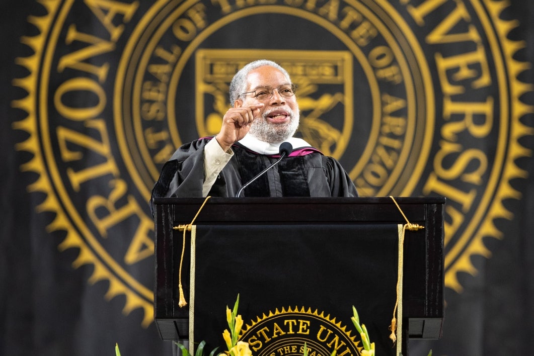 Lonnie Bunch III speaks at a podium