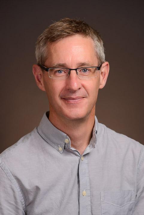 headshot of ASU prof Roger Mantie