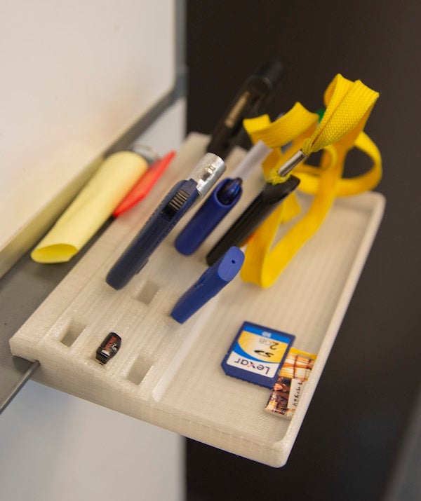 Items on a tray printed with recycled 3D printer plastic filament.