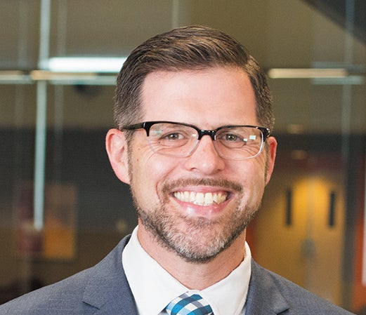 Man in tie smiling