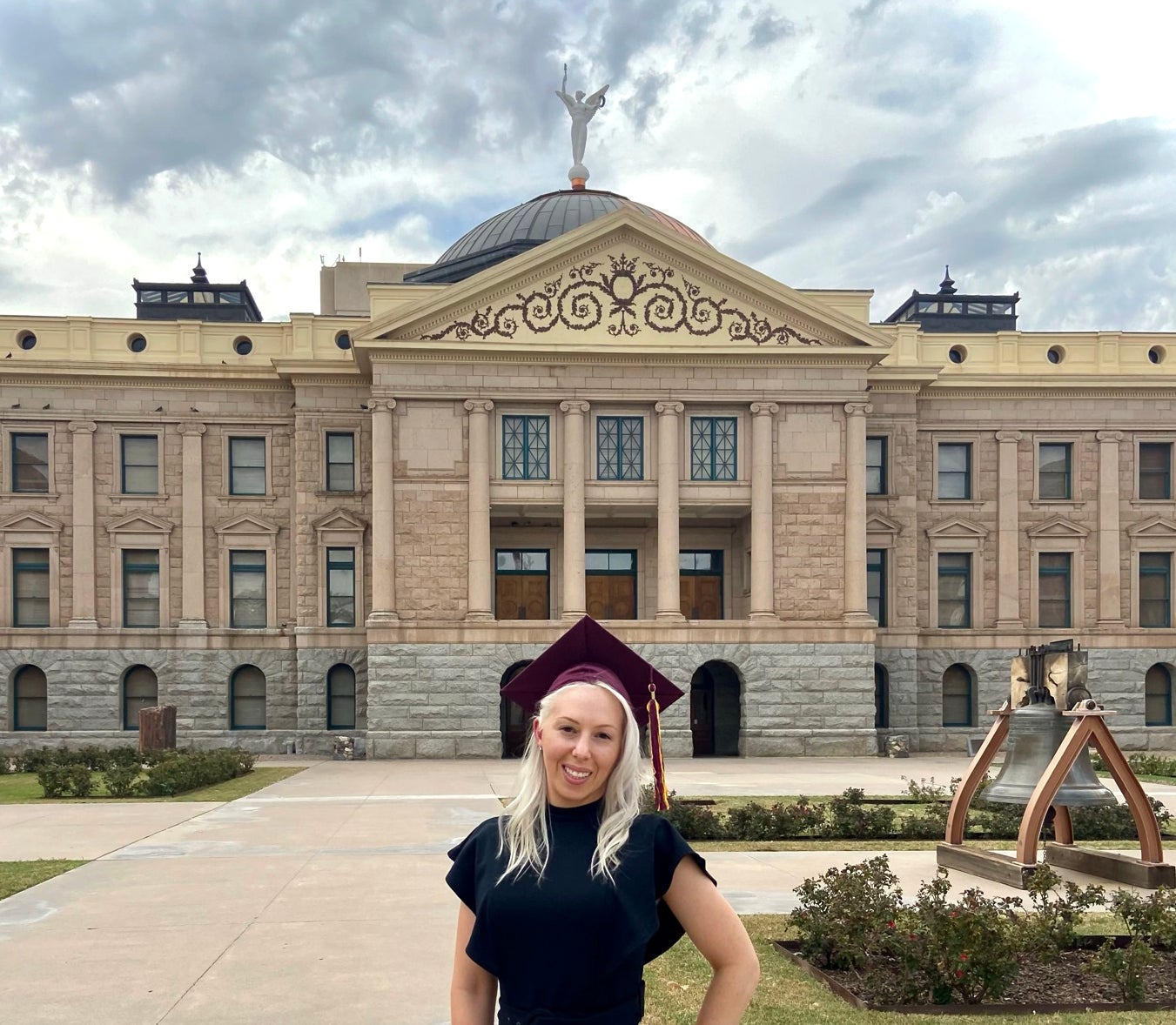 woman standing in front of Arizona capitol building