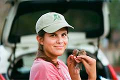 ASU student Allyson Shaw holds finches