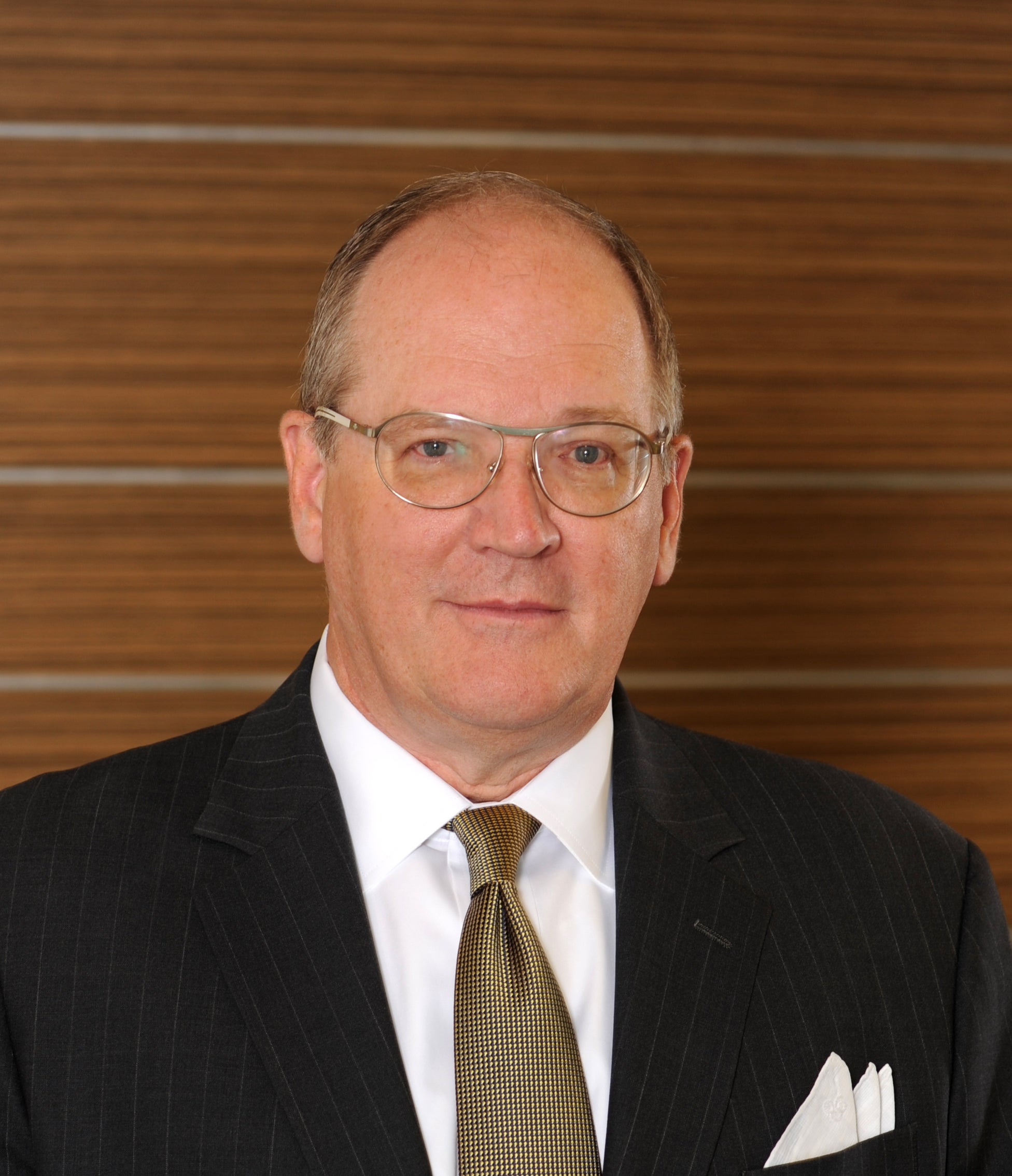 Man in glasses in black suit