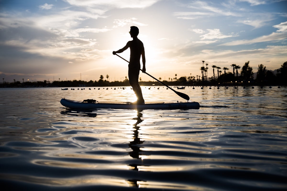 Man paddleboarding.