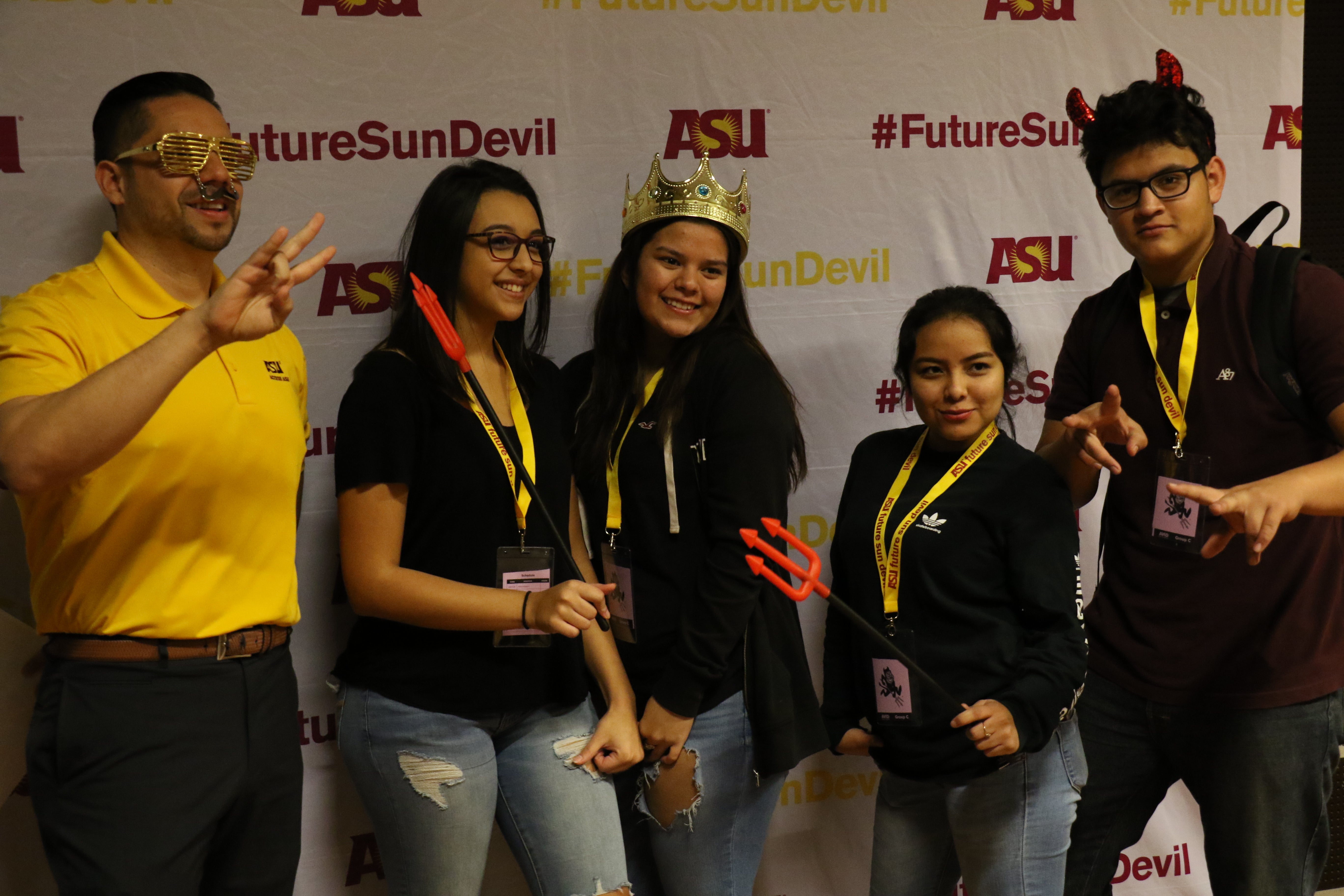 students posing at photo booth