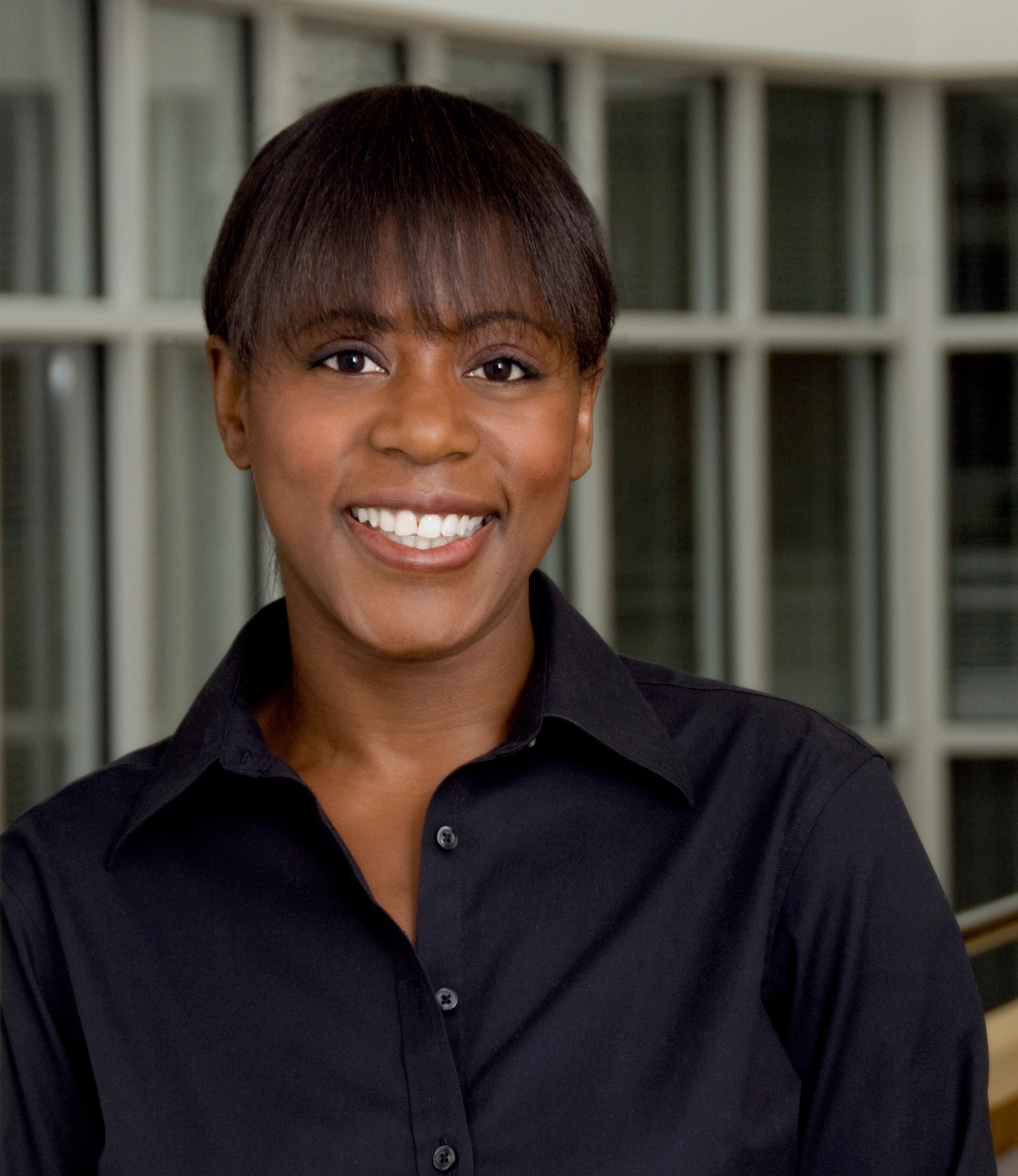 Woman in black shirt smiling