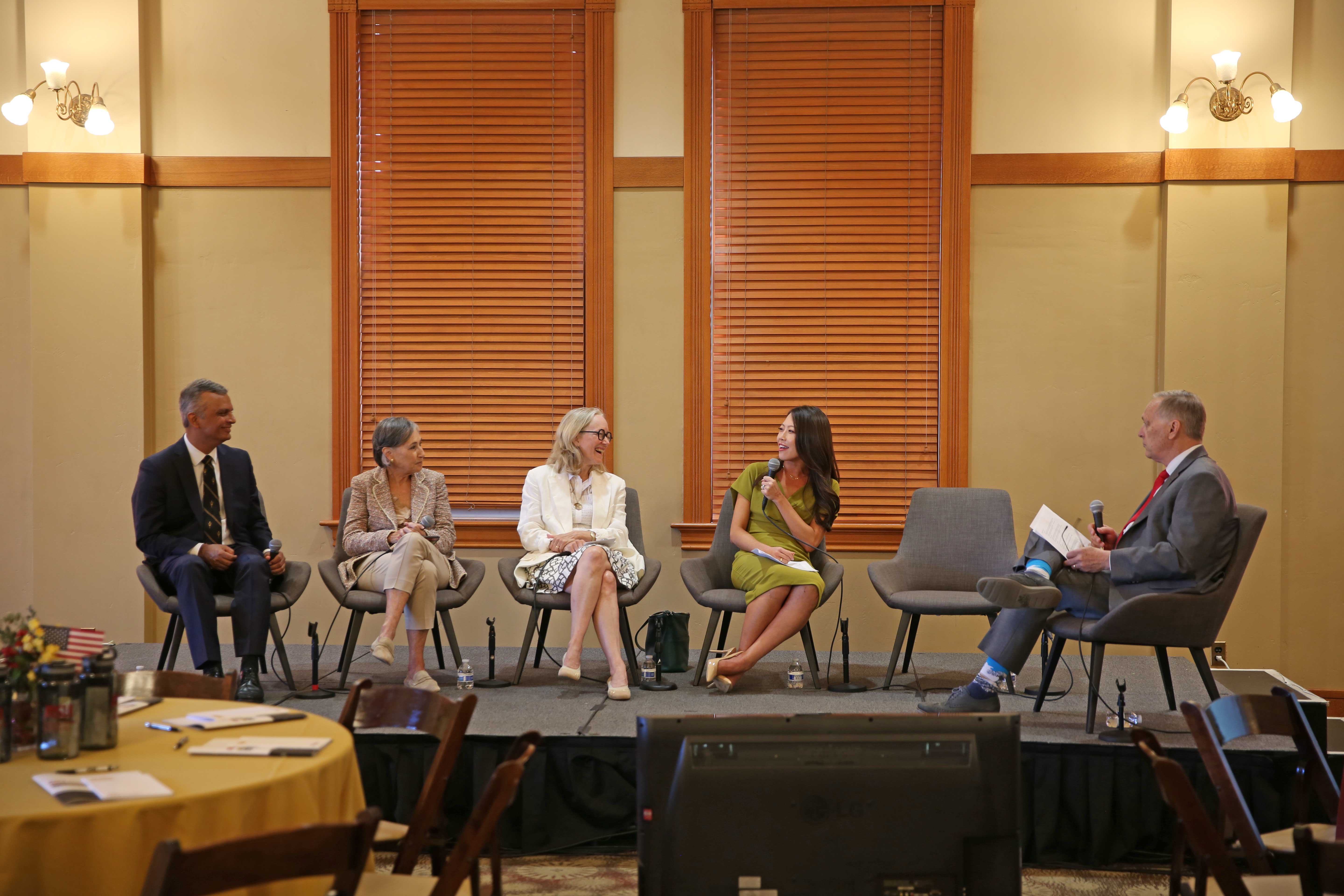 Man leads panel on stage at ASU