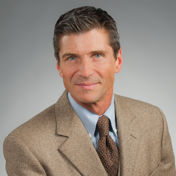 Man in suit and tie smiling