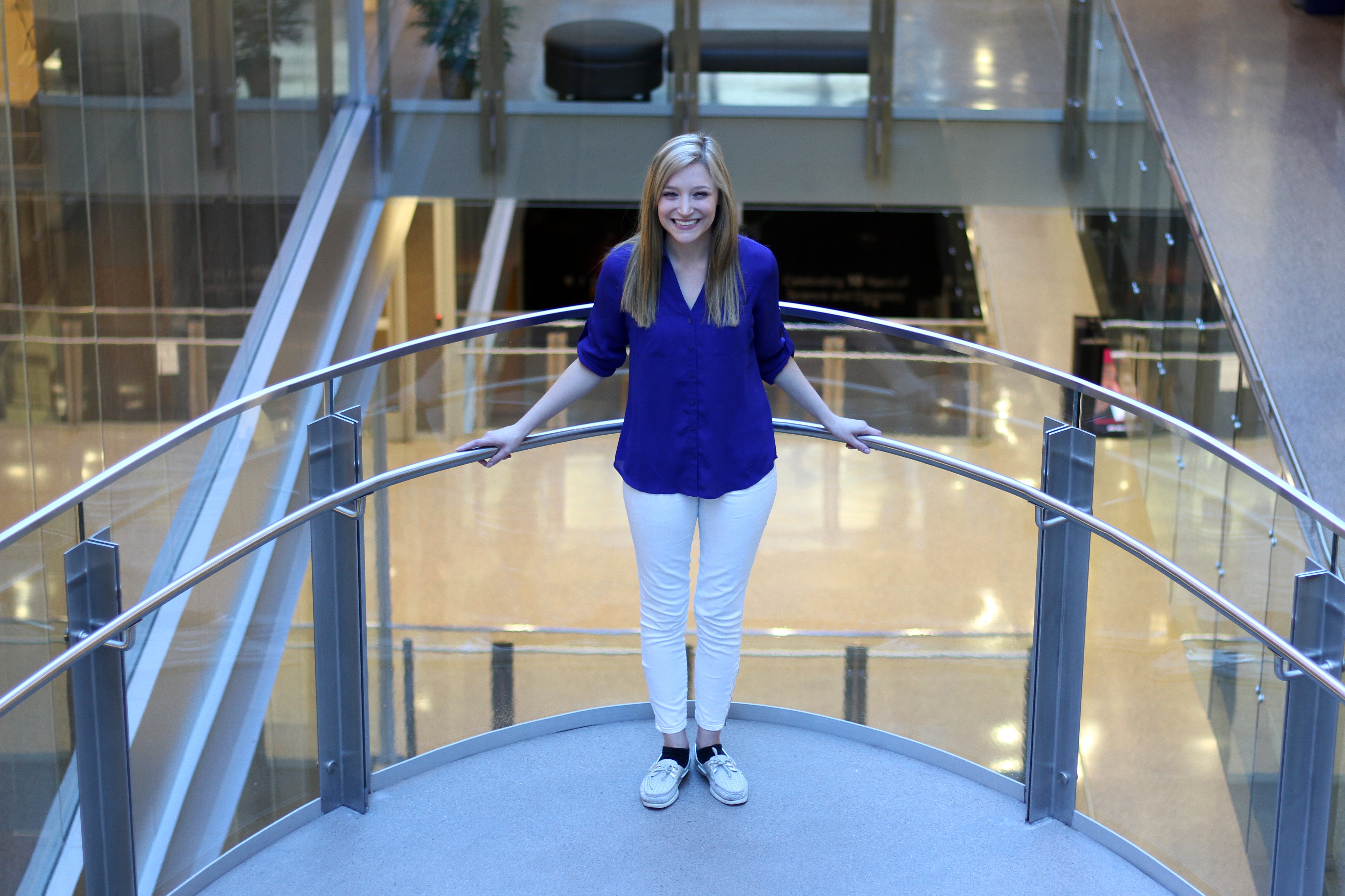 Student Breanne McCarthy portrait on a stairwell Biodesign