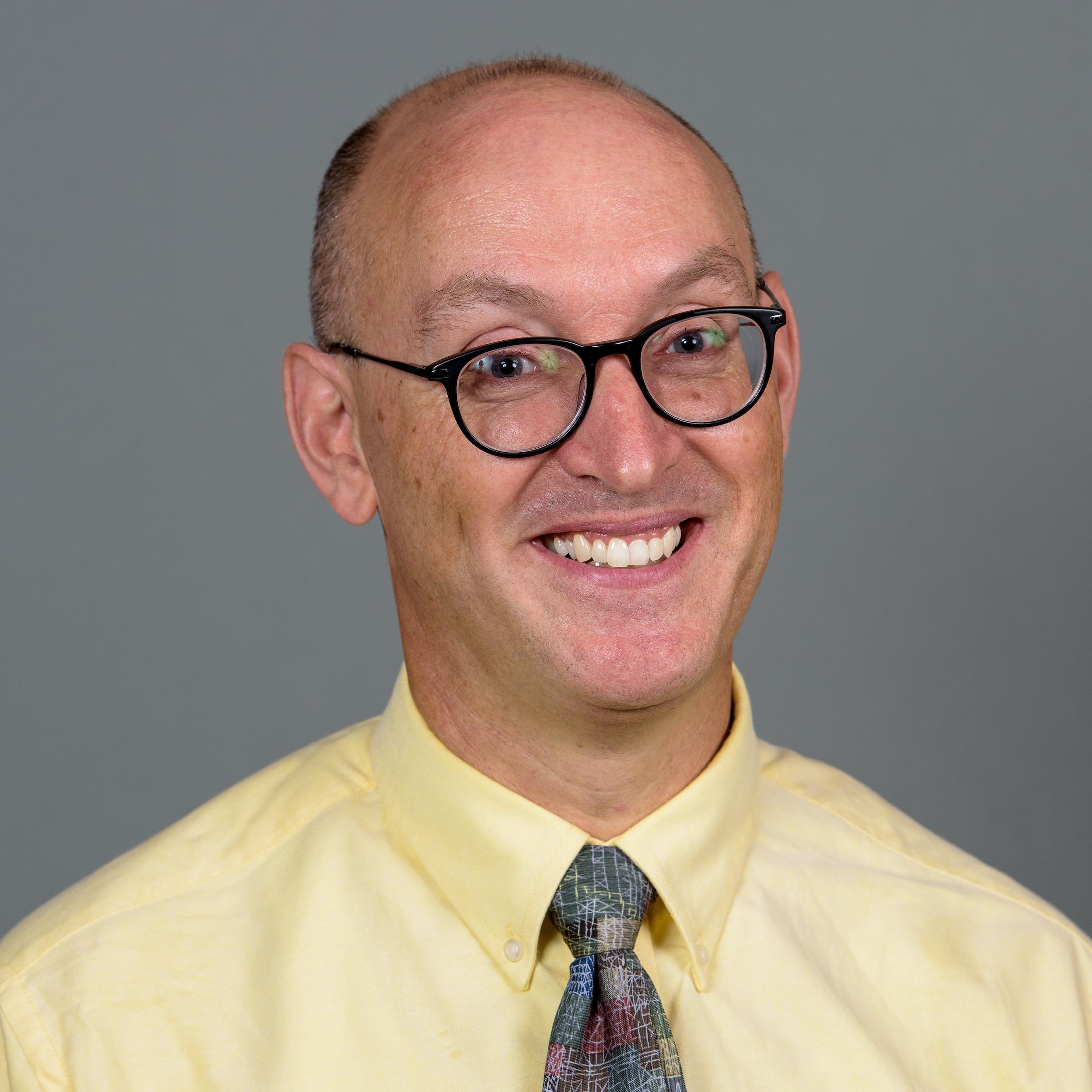 Man smiling with glasses