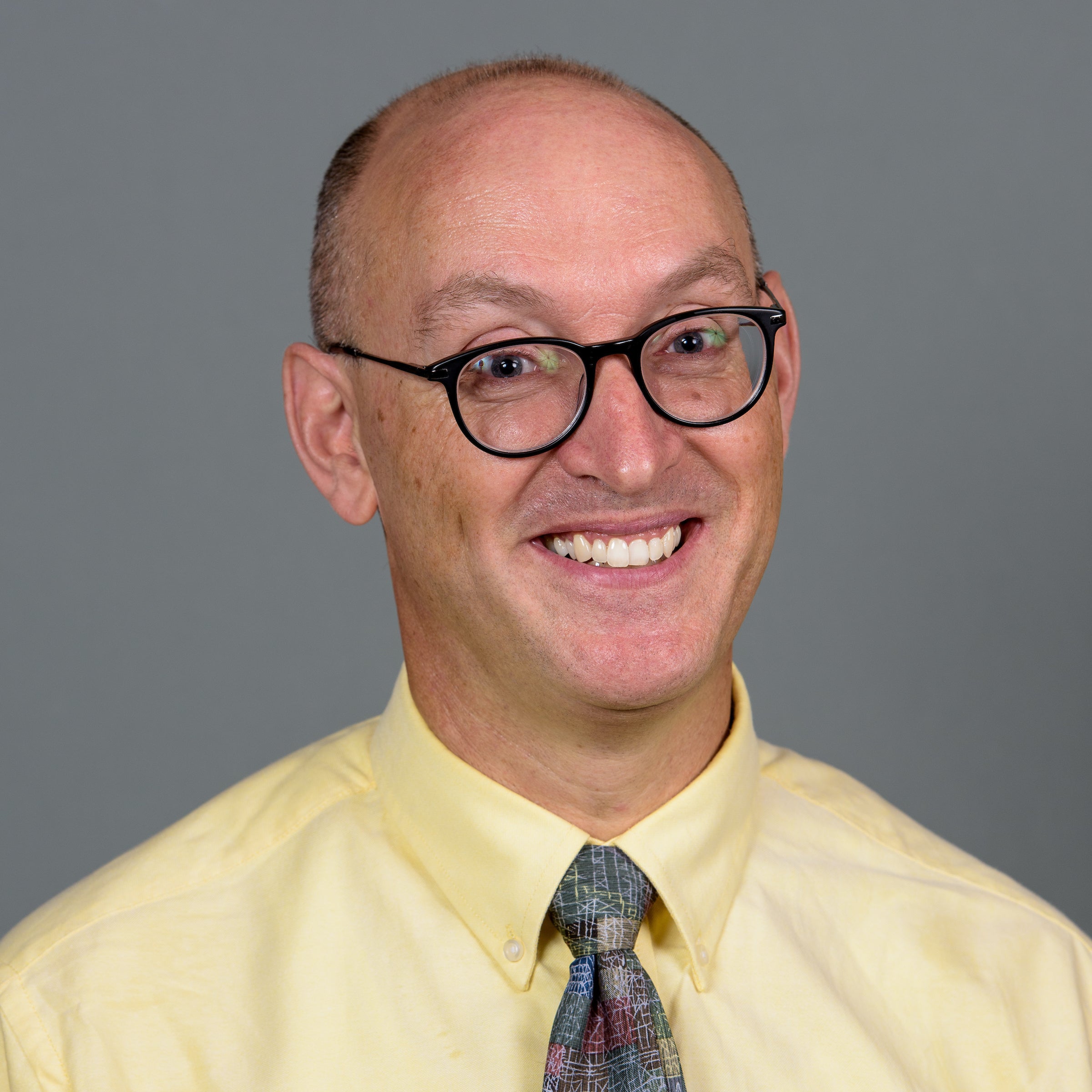 Man in tie smiling