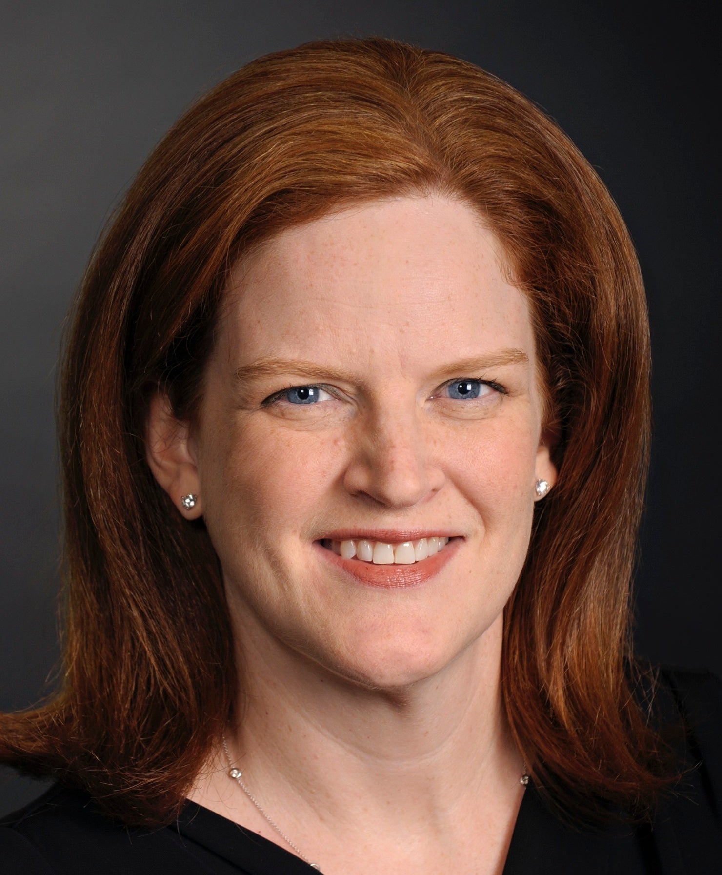 Woman with red hair smiling